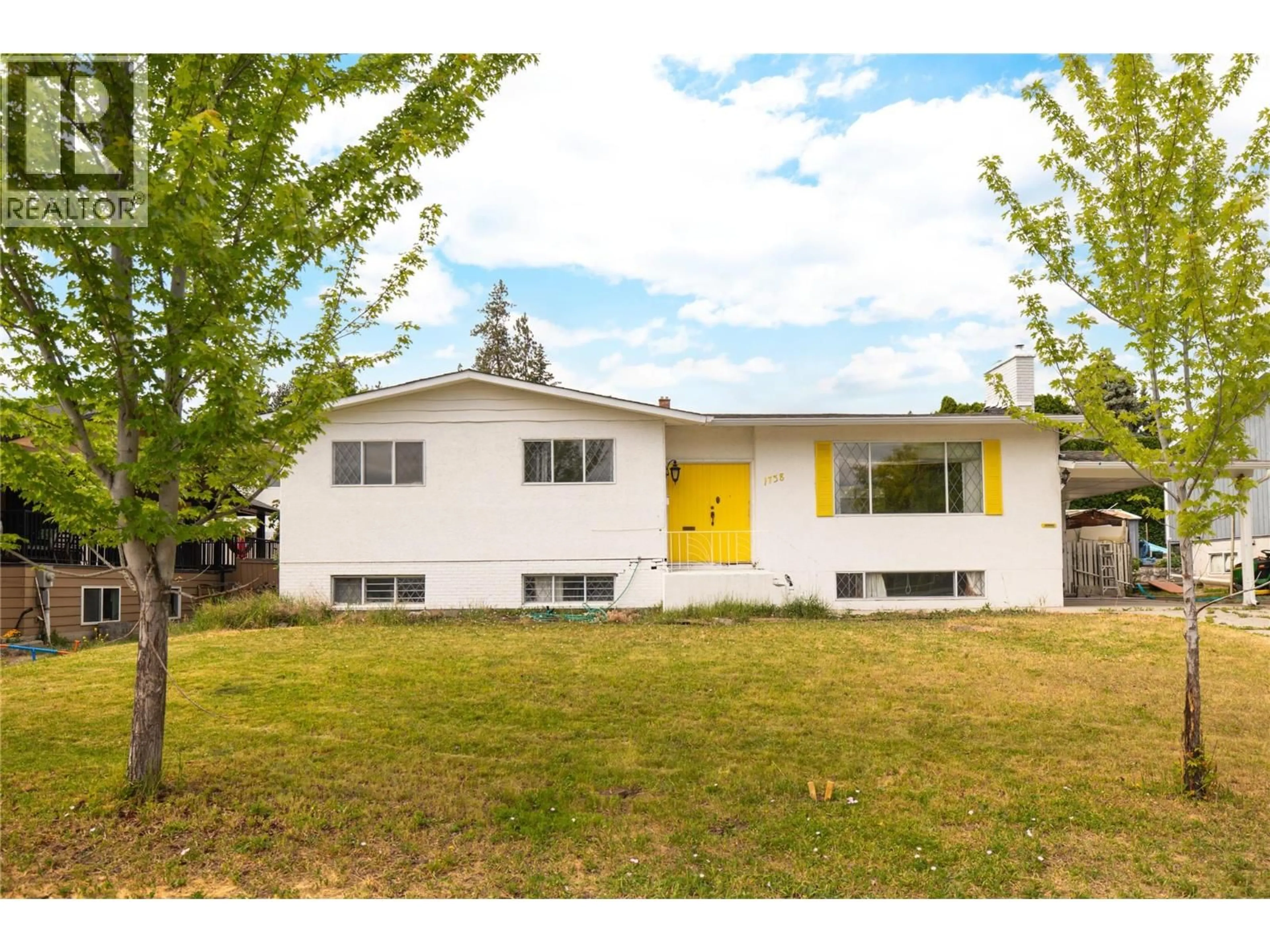Home with vinyl exterior material, street for 1738 SMITHSON DRIVE, Kelowna British Columbia V1Y4E3