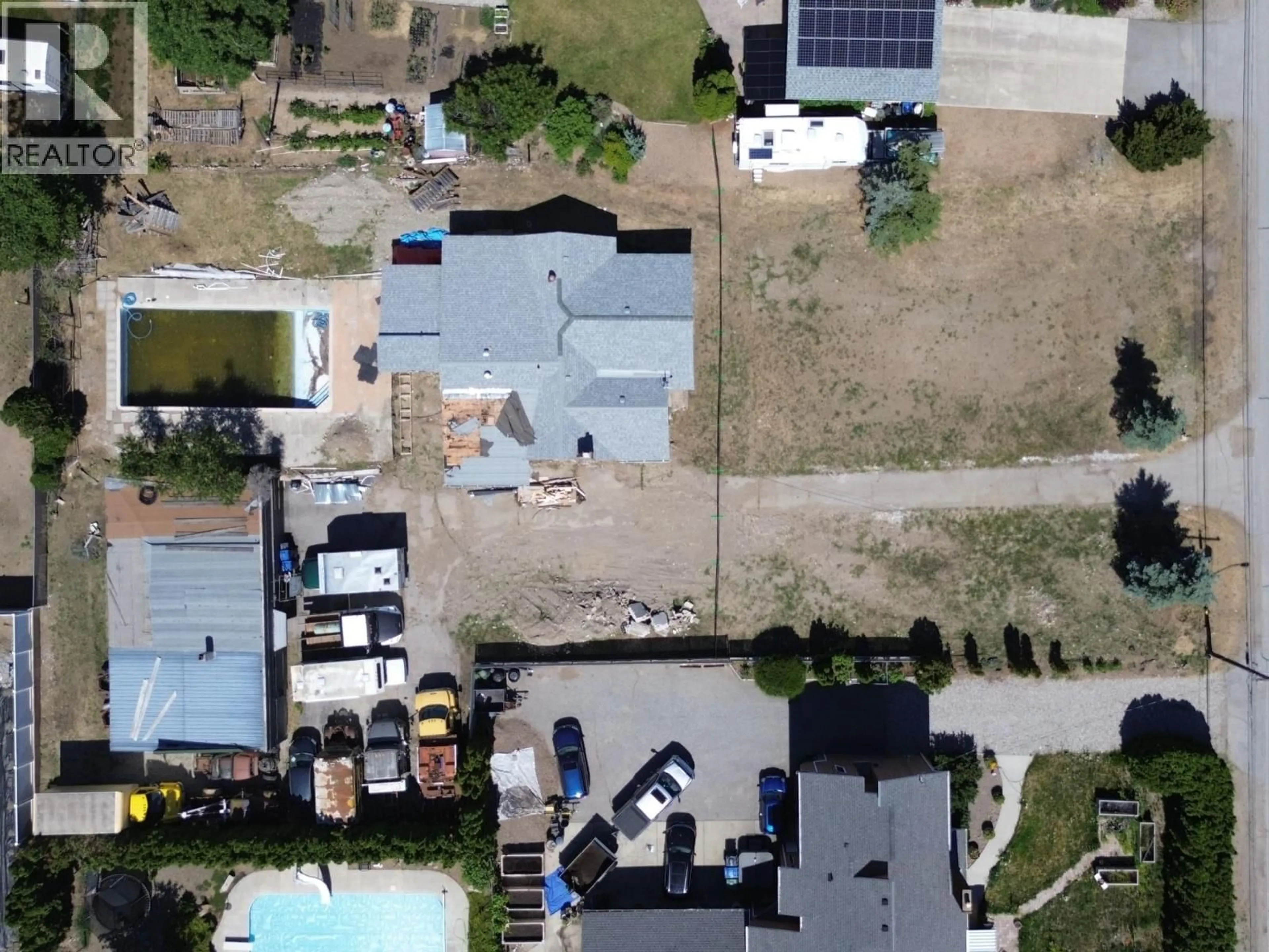 A pic from outside/outdoor area/front of a property/back of a property/a pic from drone, street for 1038 FAIRVIEW ROAD, Oliver British Columbia V0H1T1