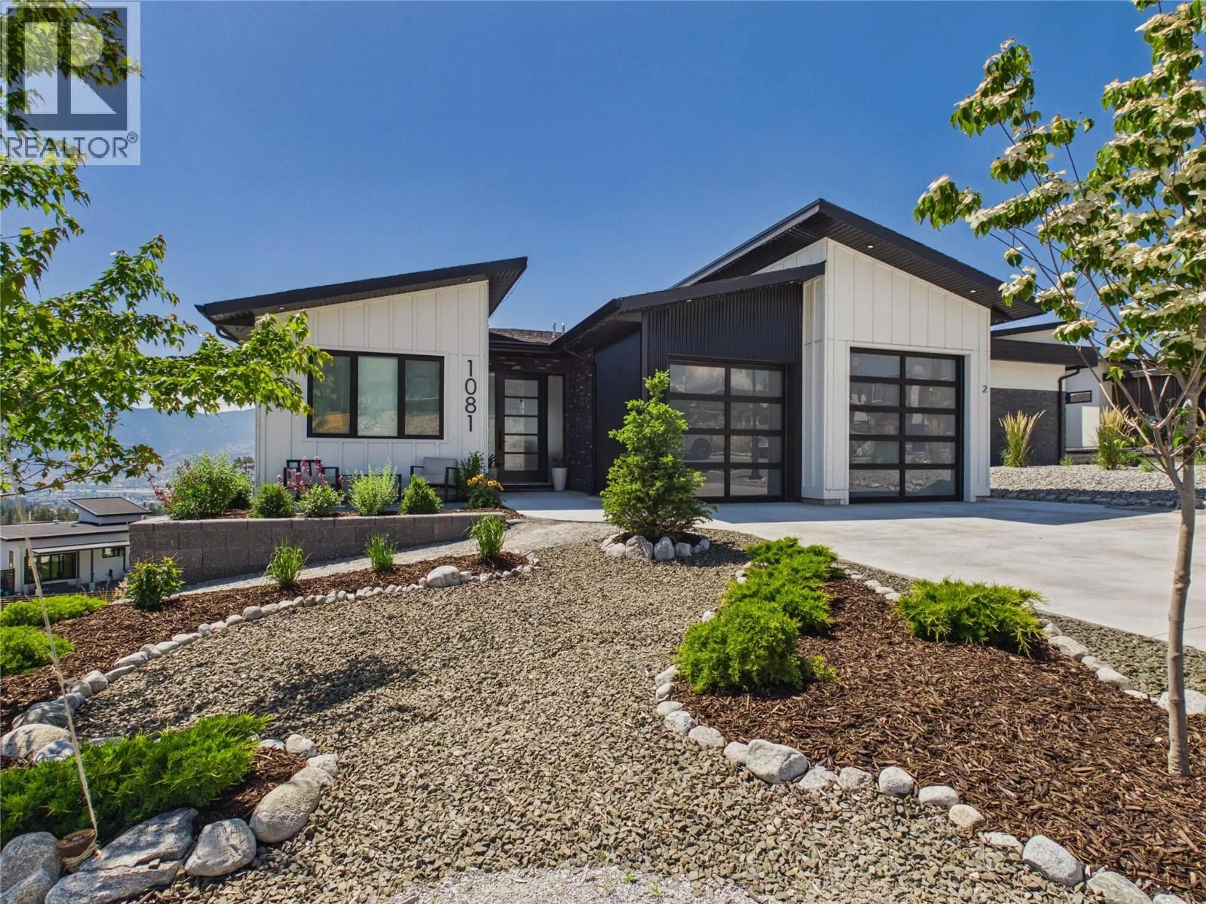 Home with vinyl exterior material, street for 1081 ANTLER DRIVE, Penticton British Columbia V2A0C9