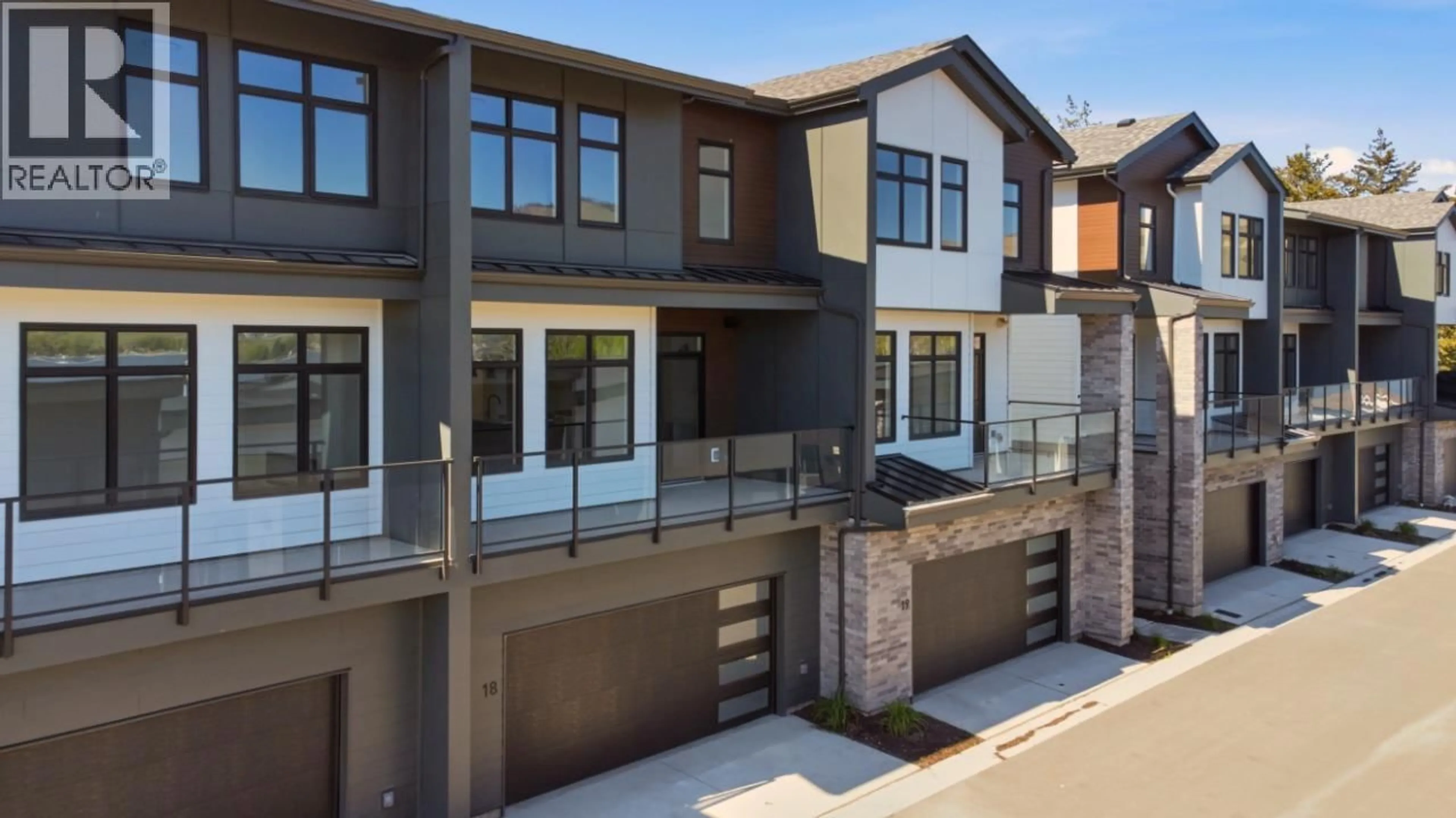 Home with brick exterior material, street for 18 - 7599 KLINGER ROAD, Okanagan Landing British Columbia V1H0B2