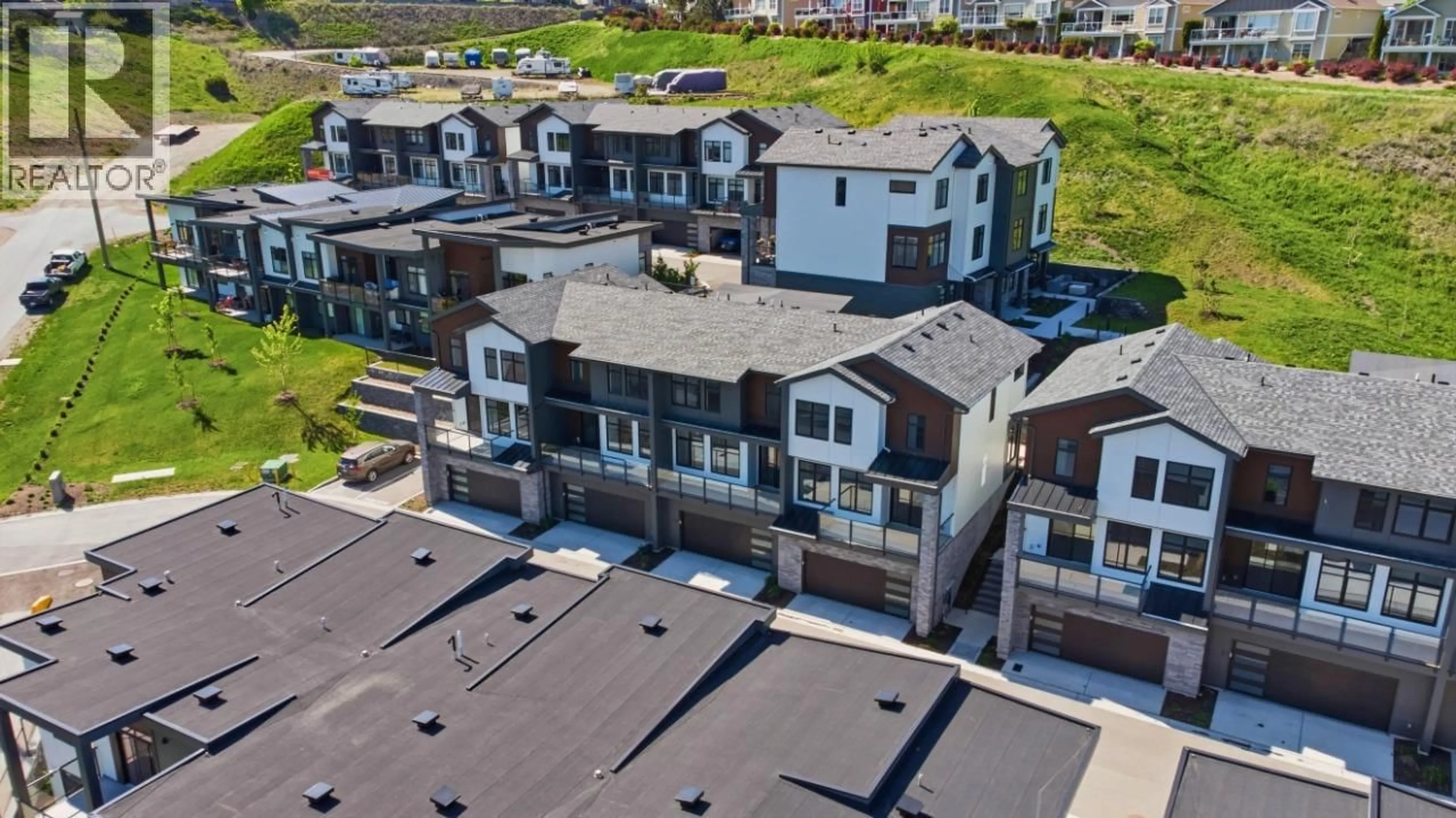 A pic from outside/outdoor area/front of a property/back of a property/a pic from drone, street for 18 - 7599 KLINGER ROAD, Okanagan Landing British Columbia V1H0B2