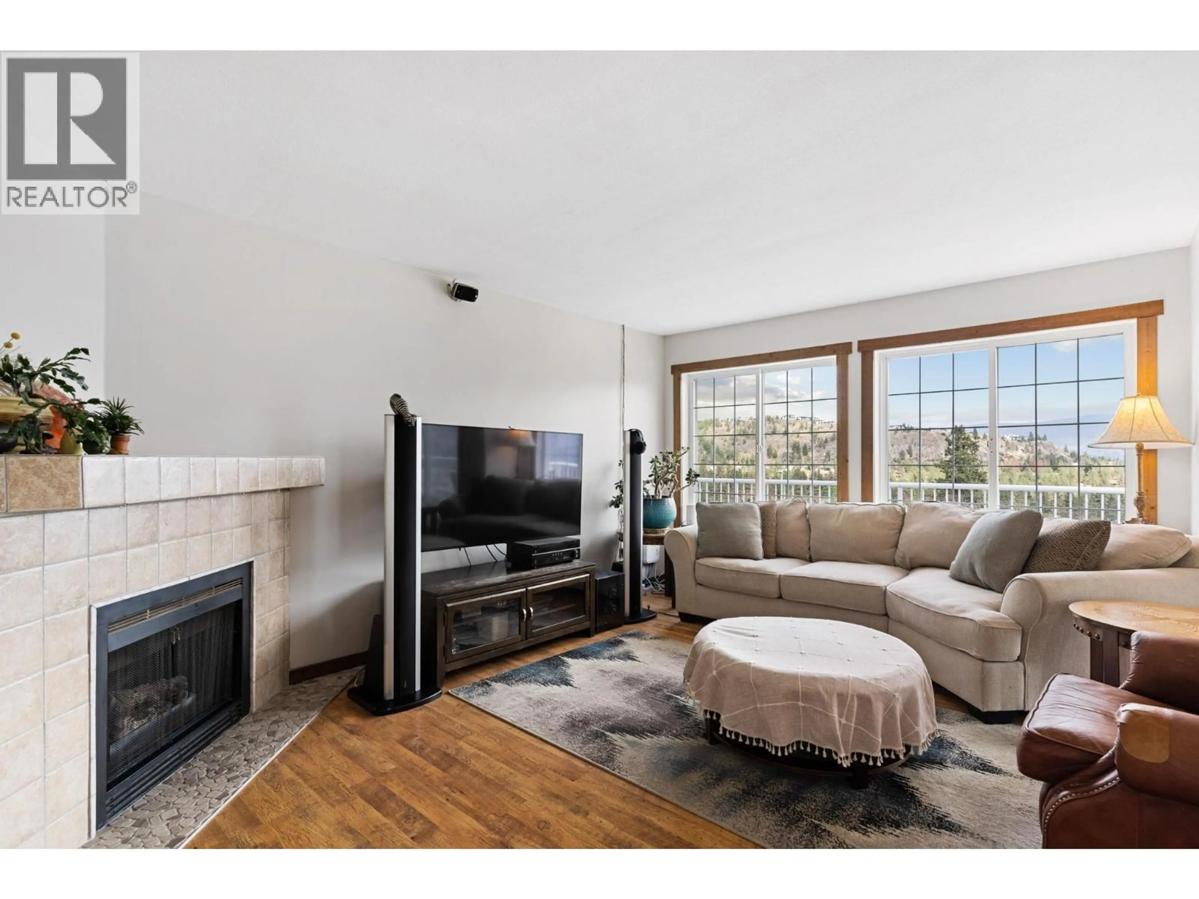 Living room with furniture, wood/laminate floor for 3052 ENSIGN WAY, West Kelowna British Columbia V4T1V1