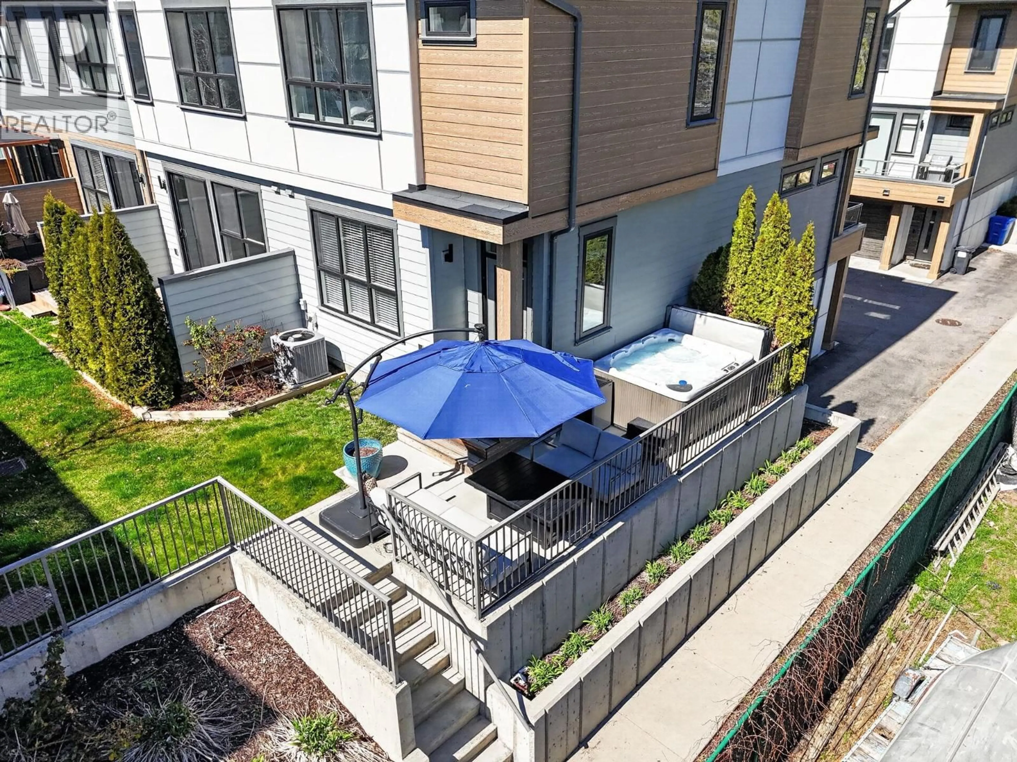 A pic from outside/outdoor area/front of a property/back of a property/a pic from drone, unknown for 201 - 11581 ROGERS ROAD, Lake Country British Columbia V4V1X8
