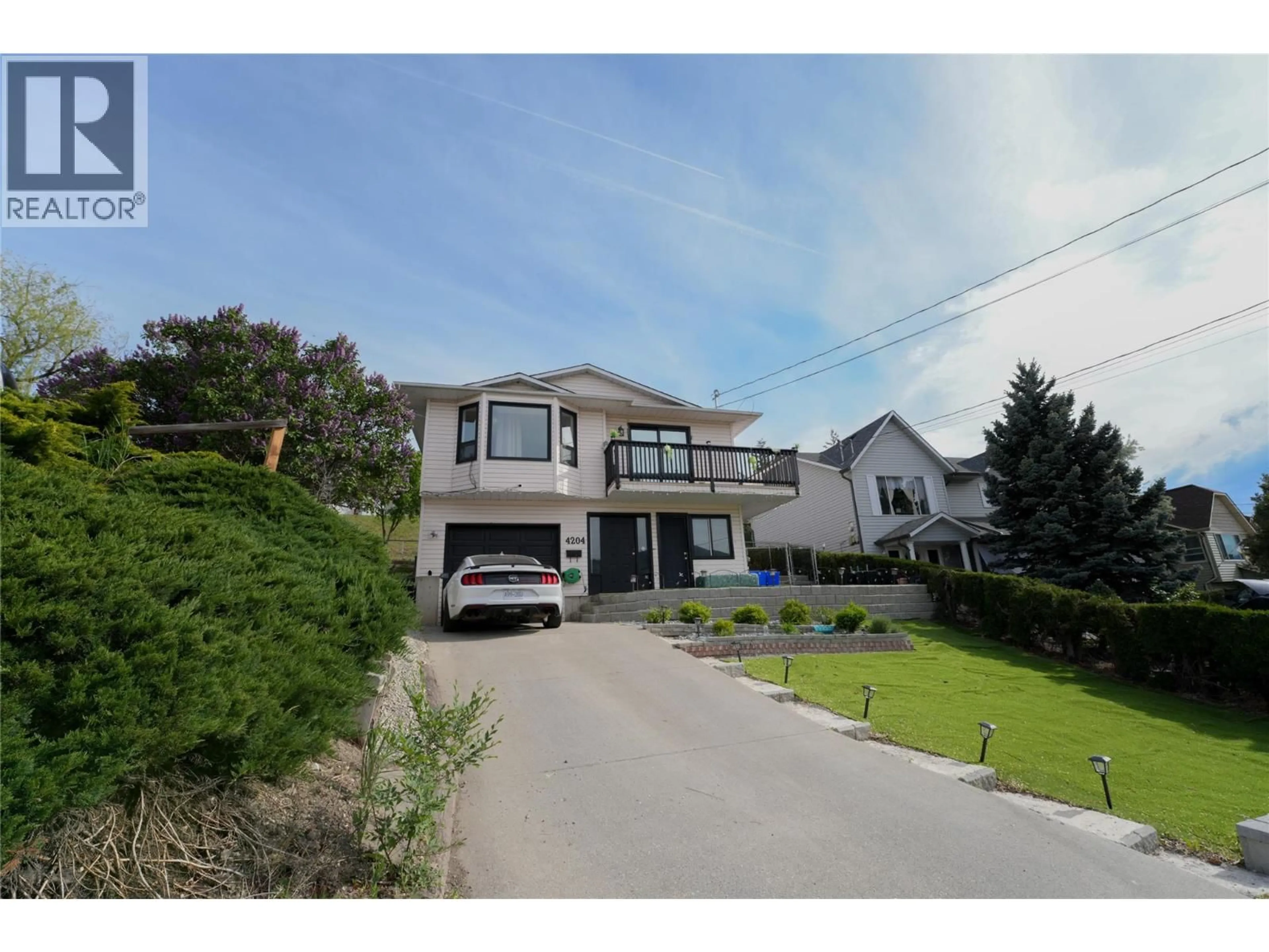 A pic from outside/outdoor area/front of a property/back of a property/a pic from drone, street for 4204 OKANAGAN AVENUE, Vernon British Columbia V1T8R4