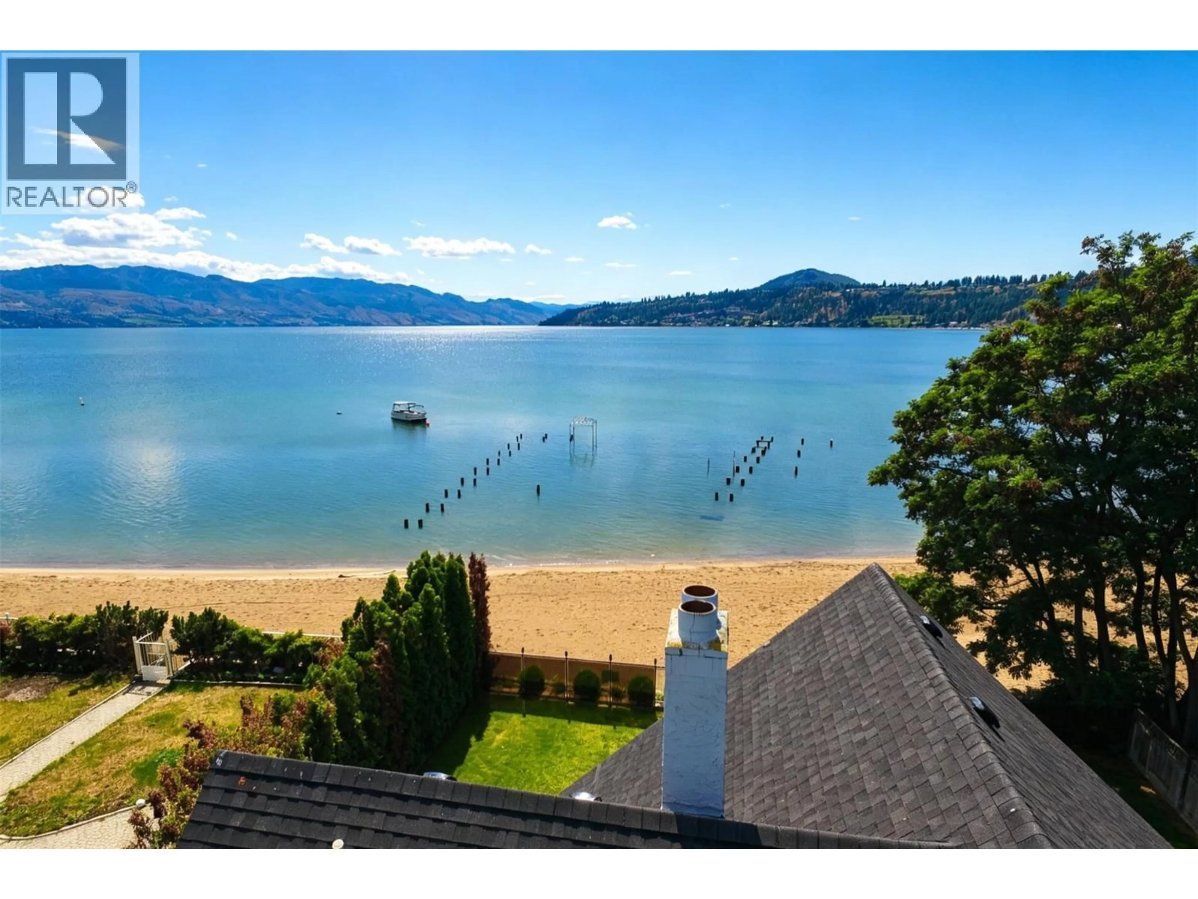 A pic from outside/outdoor area/front of a property/back of a property/a pic from drone, water/lake/river/ocean view for 124 MCTAVISH AVENUE, Kelowna British Columbia V1Y5W3
