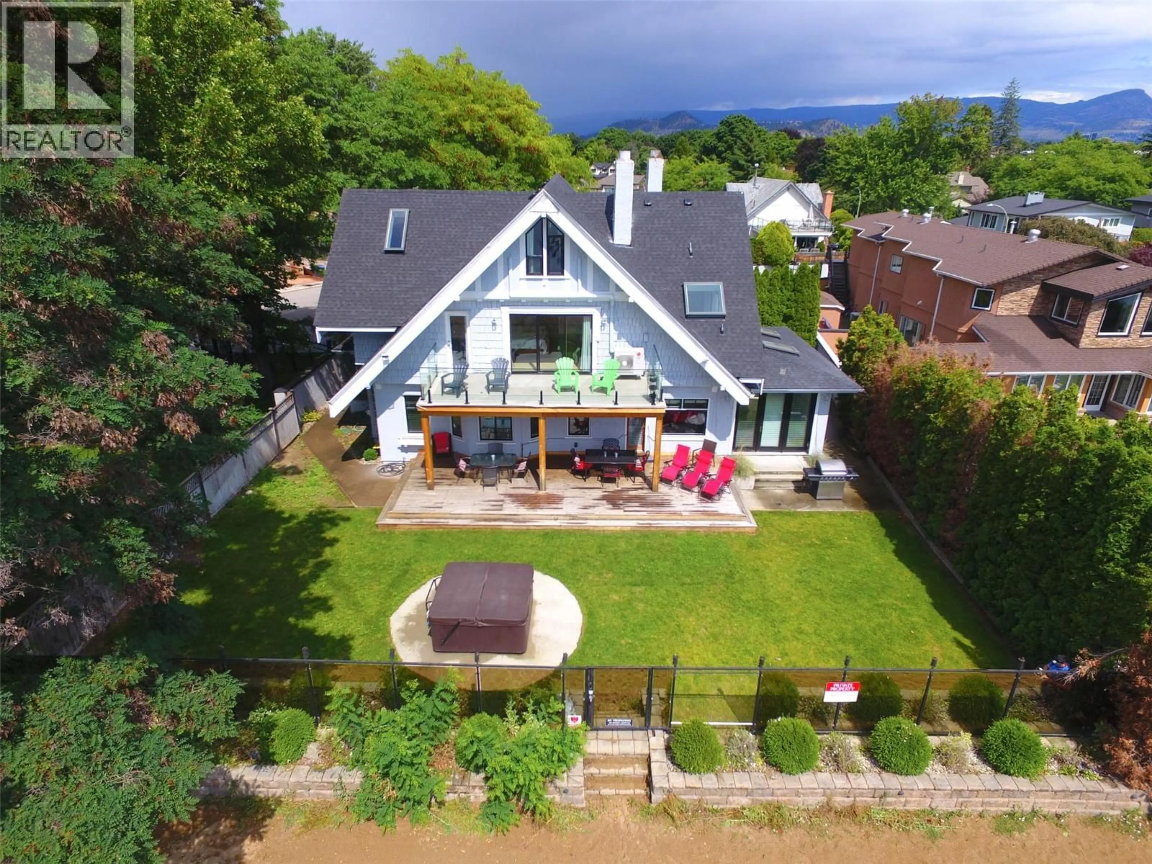 A pic from outside/outdoor area/front of a property/back of a property/a pic from drone, mountain view for 124 MCTAVISH AVENUE, Kelowna British Columbia V1Y5W3