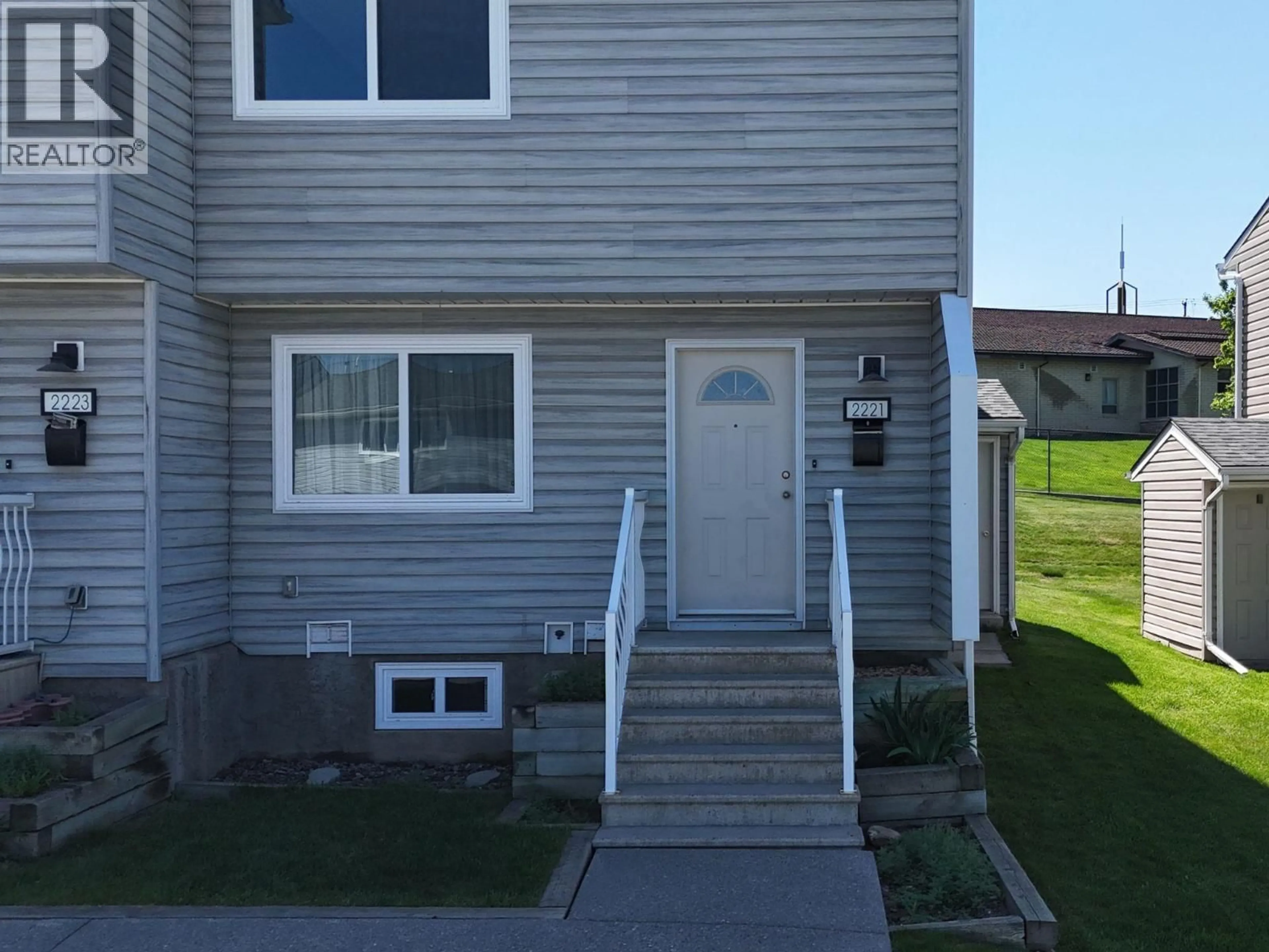 Home with vinyl exterior material, street for 2221 3RD STREET NORTH, Cranbrook British Columbia V1C5G7