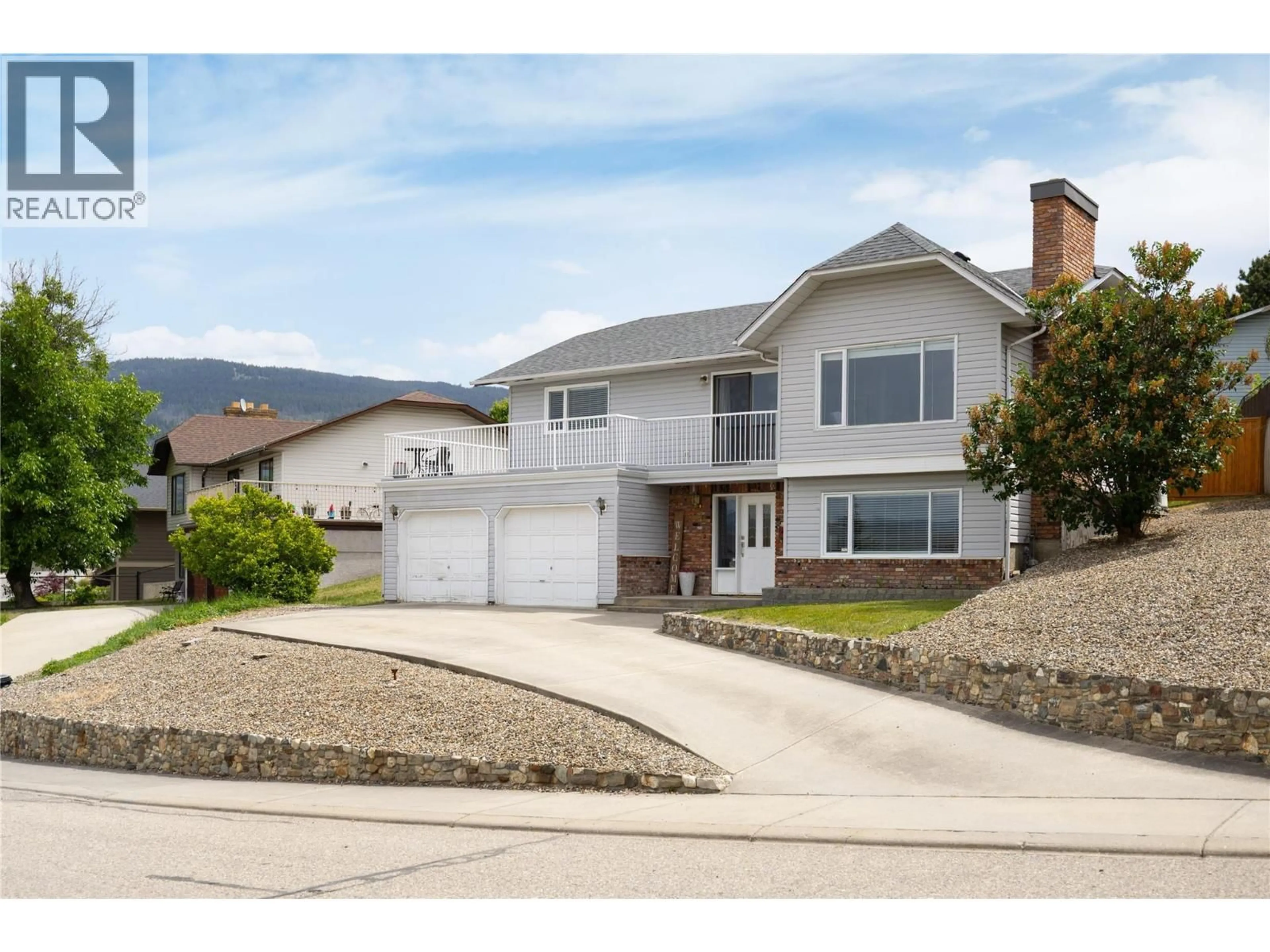Home with vinyl exterior material, street for 1078 MT. BALDUR DRIVE, Vernon British Columbia V1B2N7