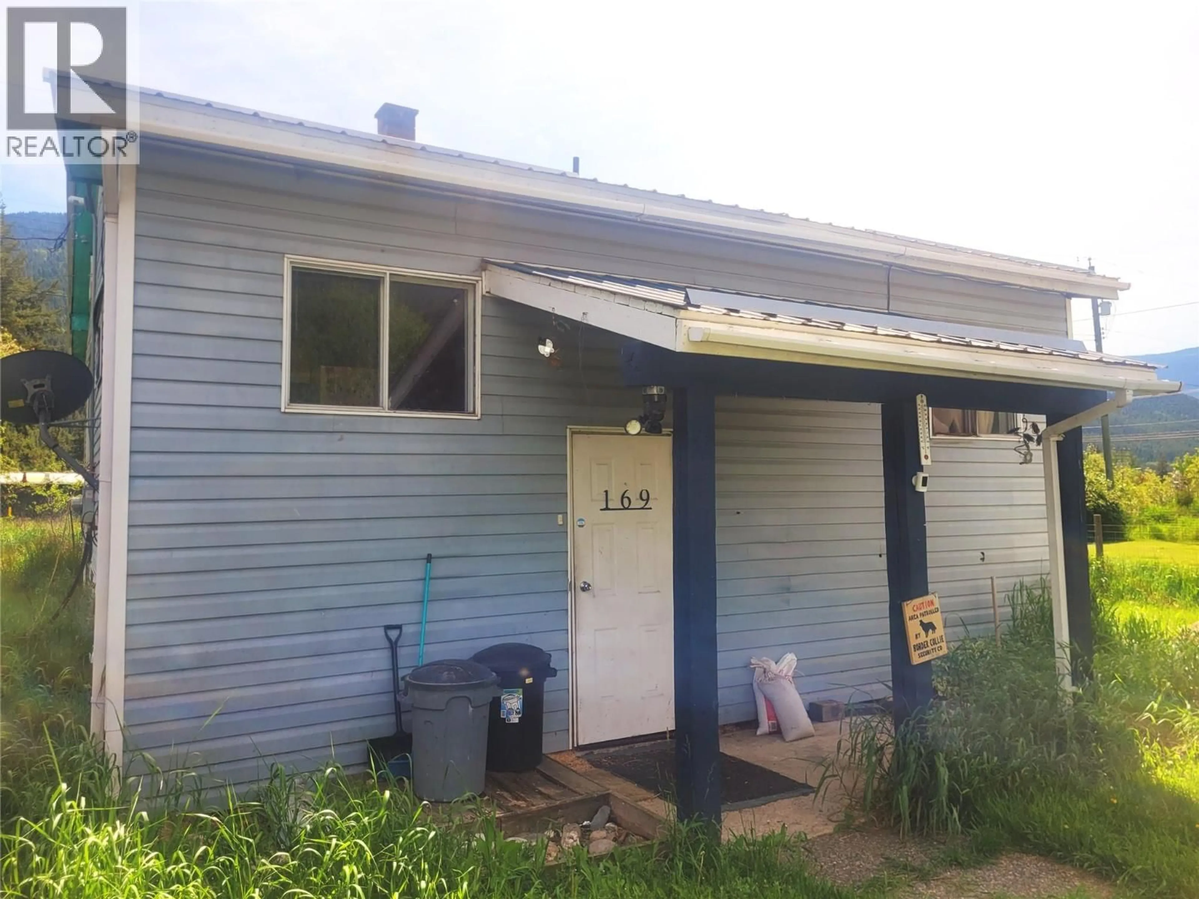 Home with vinyl exterior material, street for 169 WOOD ROAD, Vavenby British Columbia V0E3A0