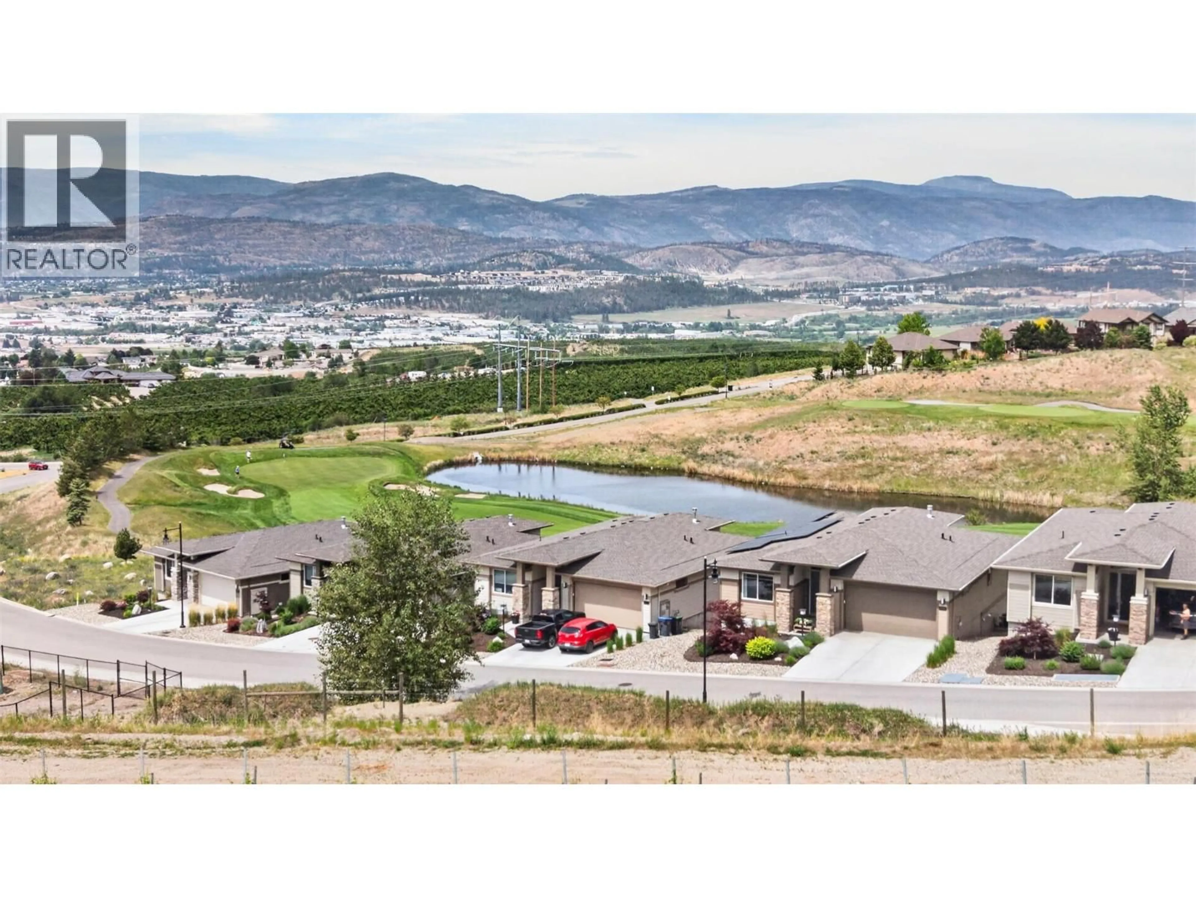 A pic from outside/outdoor area/front of a property/back of a property/a pic from drone, mountain view for 1380 TOWER RANCH DRIVE, Kelowna British Columbia V1P1T8