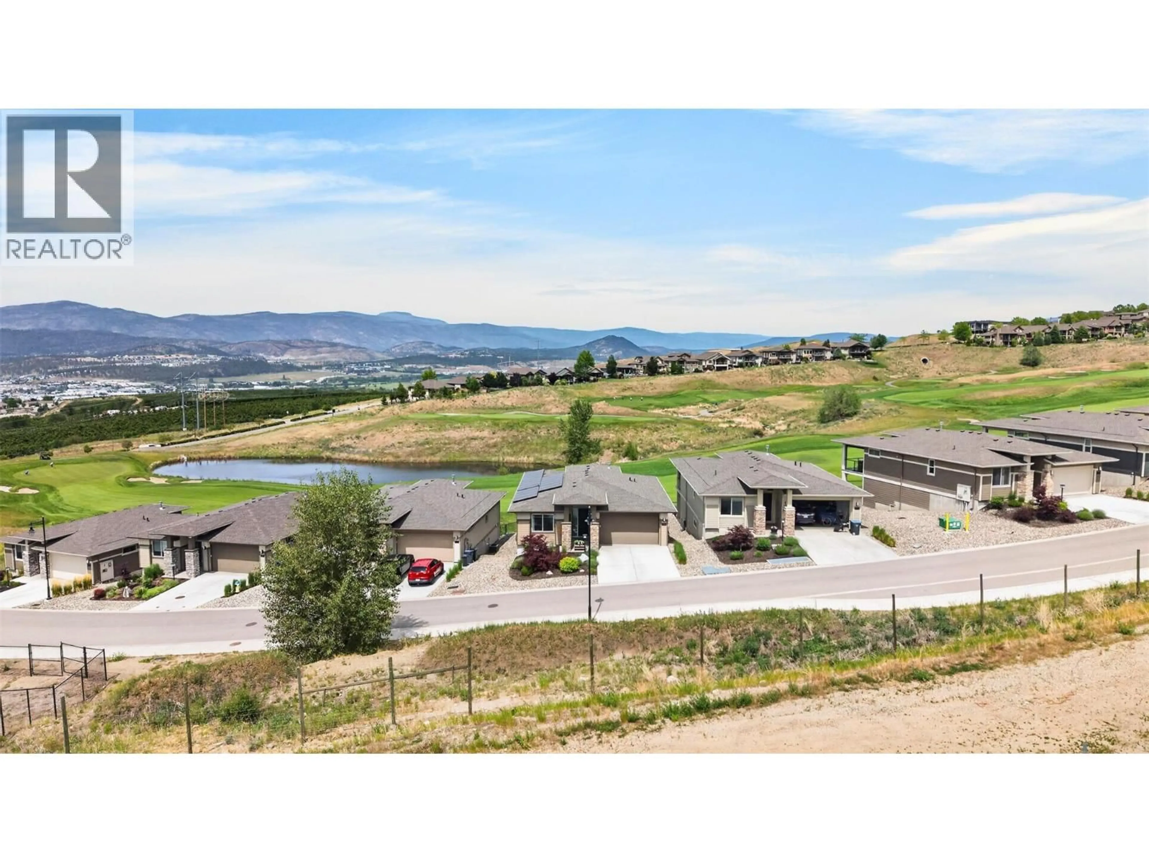 A pic from outside/outdoor area/front of a property/back of a property/a pic from drone, mountain view for 1380 TOWER RANCH DRIVE, Kelowna British Columbia V1P1T8