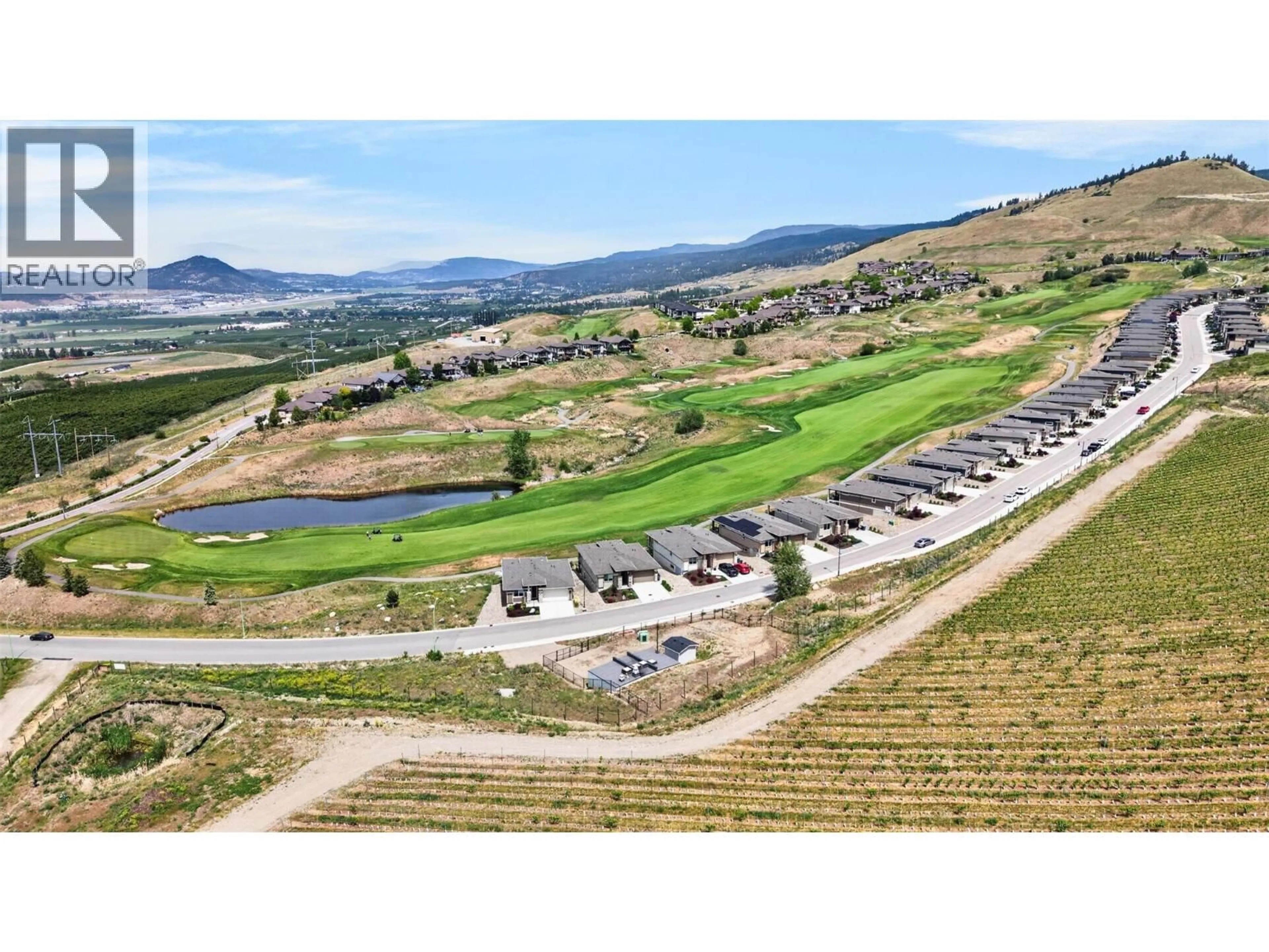 A pic from outside/outdoor area/front of a property/back of a property/a pic from drone, mountain view for 1380 TOWER RANCH DRIVE, Kelowna British Columbia V1P1T8