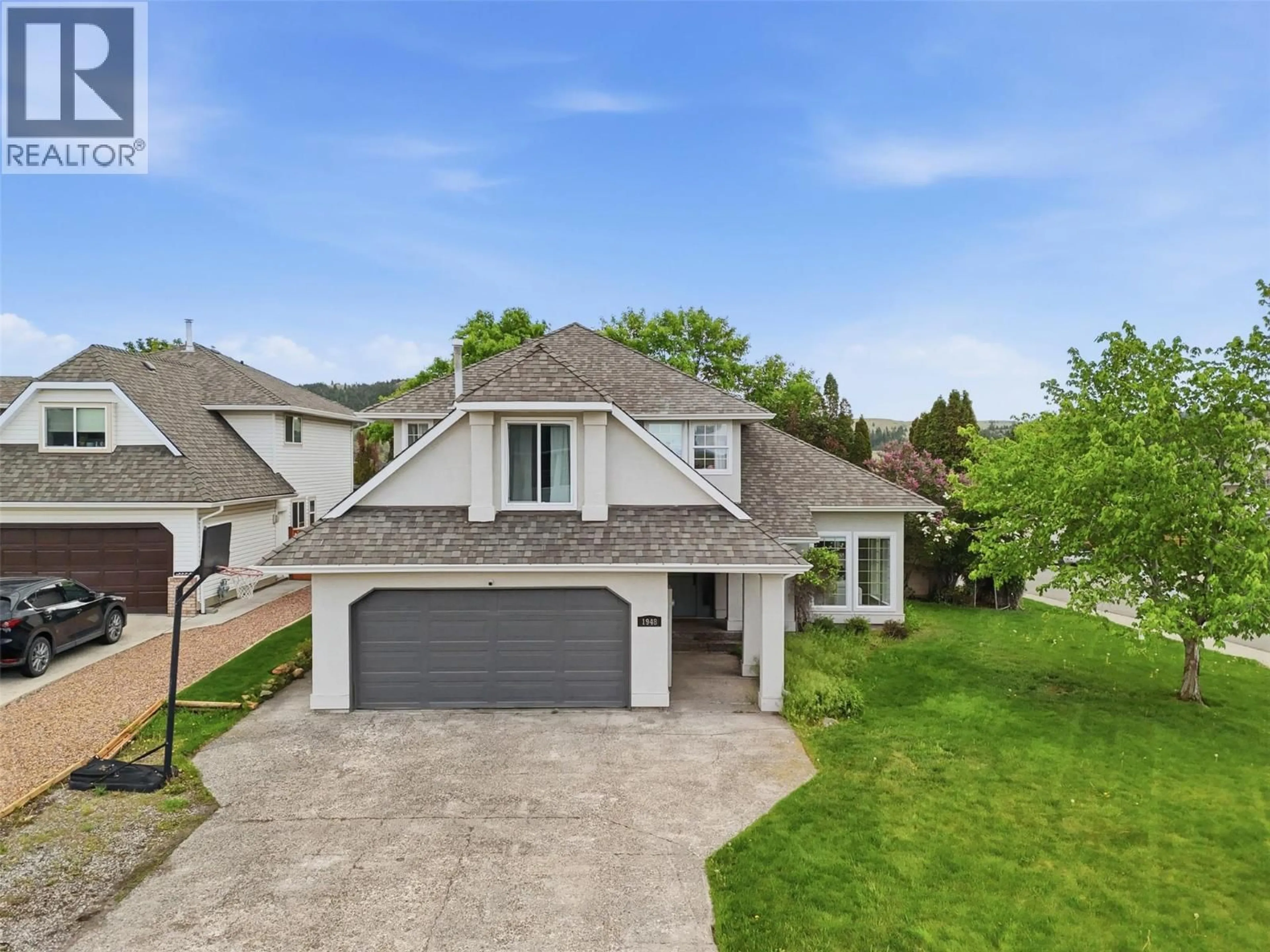 A pic from outside/outdoor area/front of a property/back of a property/a pic from drone, street for 1948 SHEFFIELD WAY, Kamloops British Columbia V2E2M2