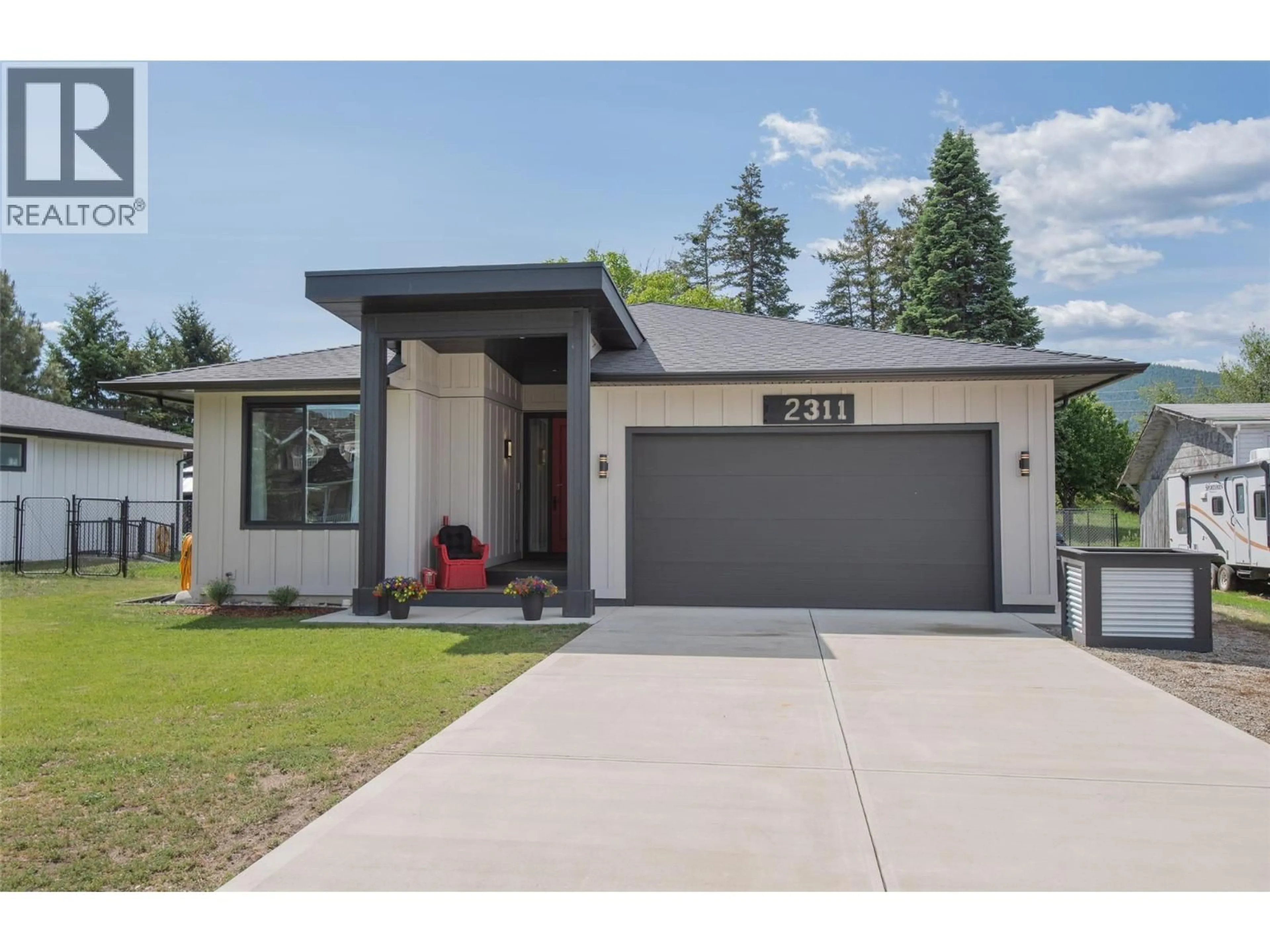 Home with vinyl exterior material, street for 2311 THORNBER STREET, Summerland British Columbia V0H1Z9