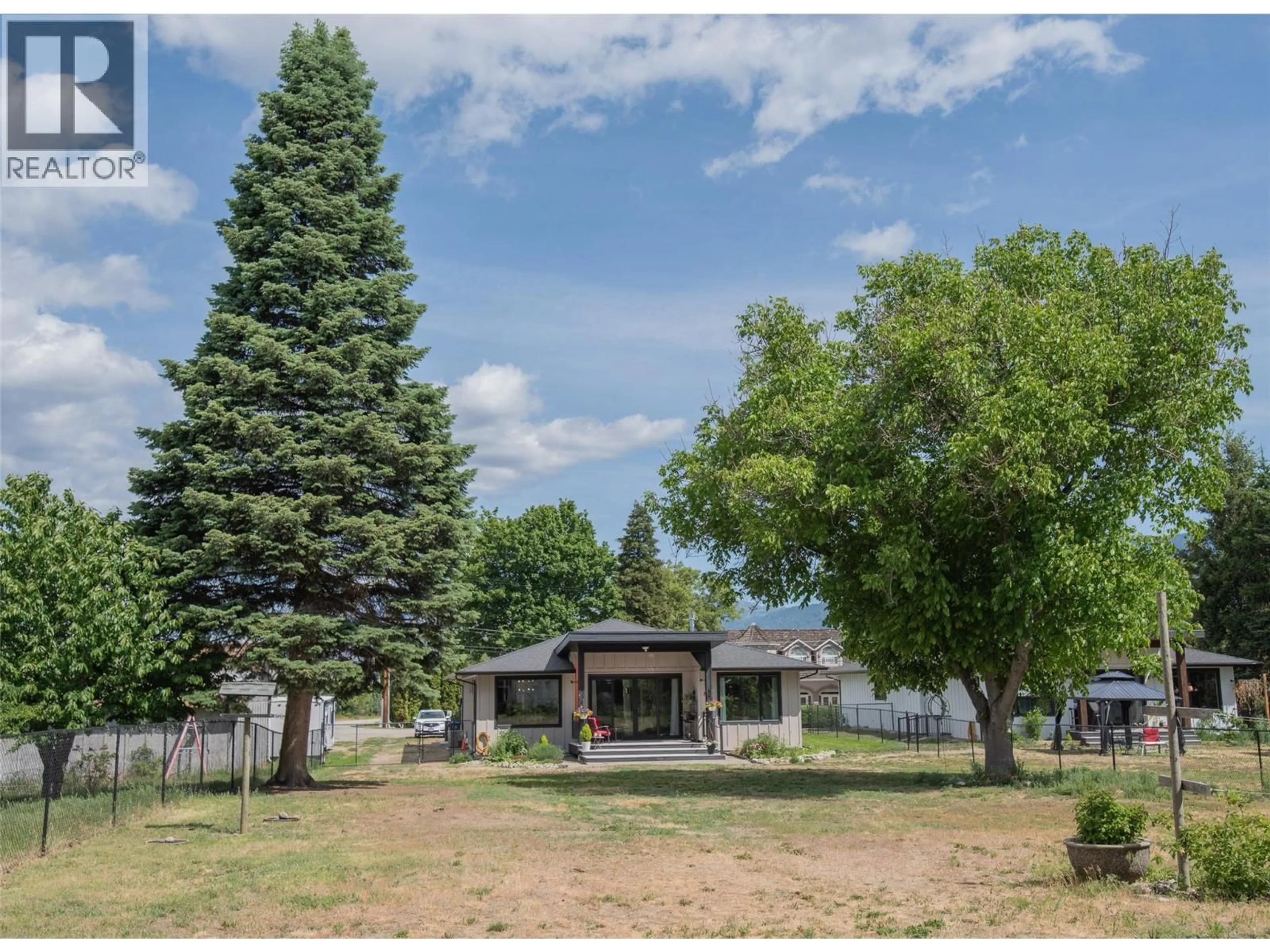 A pic from outside/outdoor area/front of a property/back of a property/a pic from drone, mountain view for 2311 THORNBER STREET, Summerland British Columbia V0H1Z9