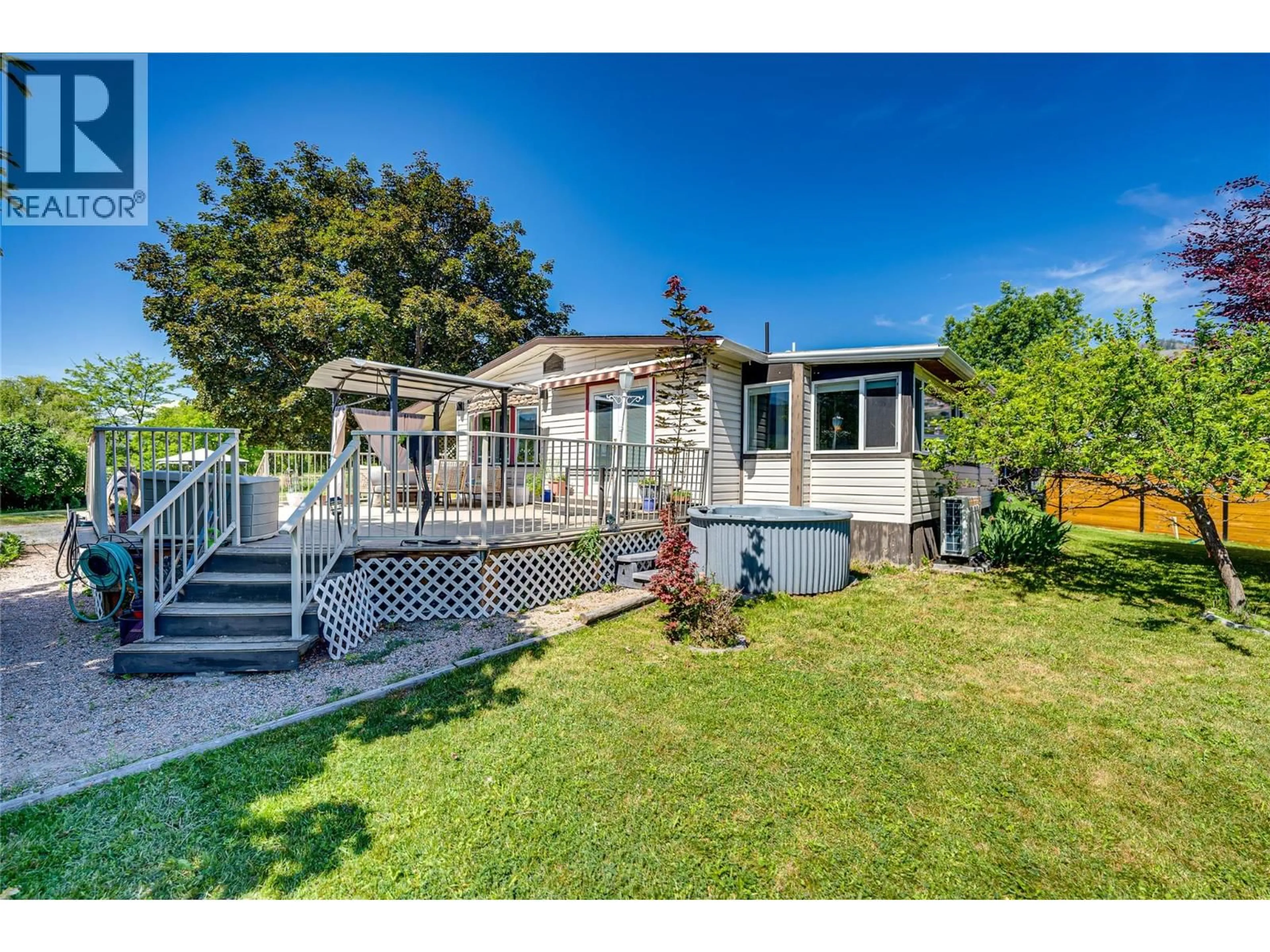 A pic from outside/outdoor area/front of a property/back of a property/a pic from drone, unknown for 106 - 2727 LAKESHORE ROAD, Vernon British Columbia V1H1X5