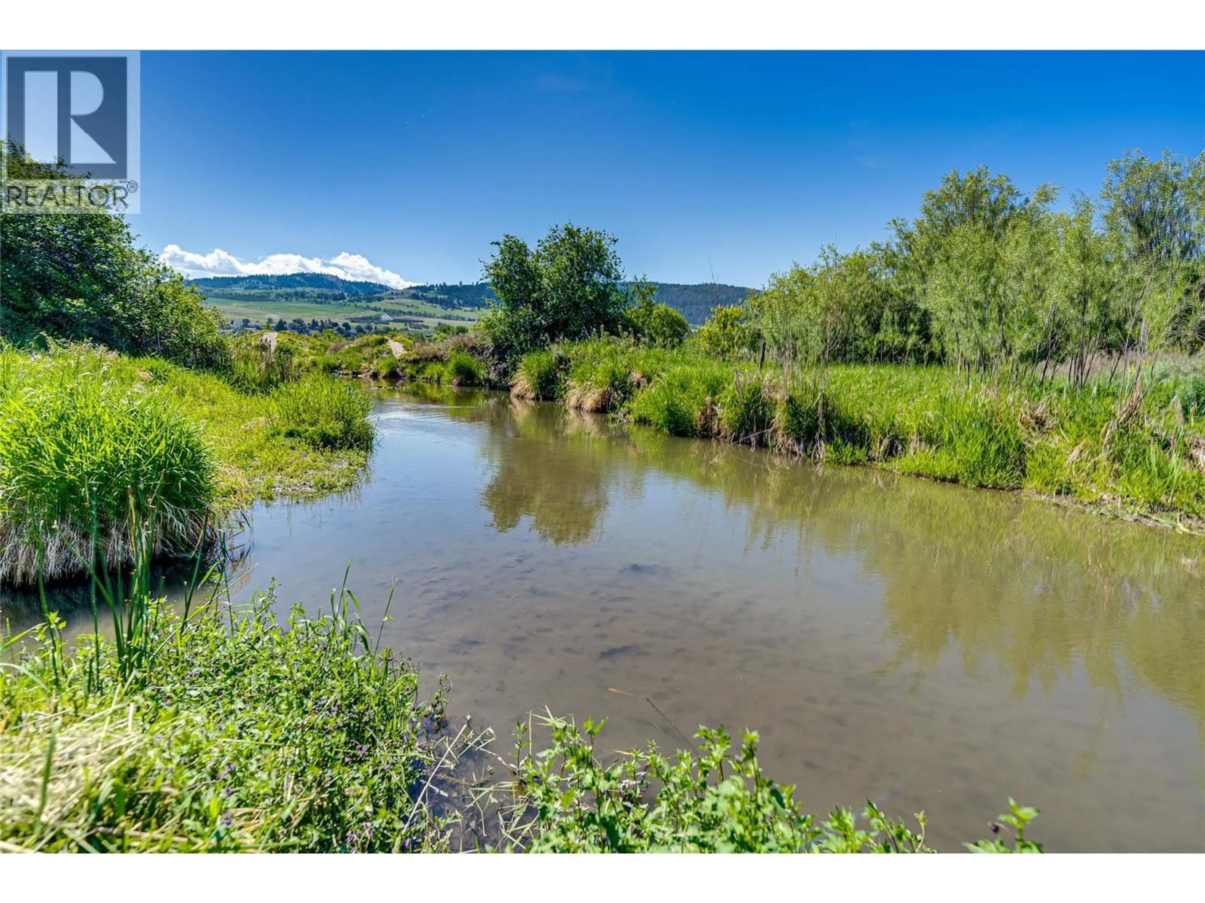 A pic from outside/outdoor area/front of a property/back of a property/a pic from drone, water/lake/river/ocean view for 106 - 2727 LAKESHORE ROAD, Vernon British Columbia V1H1X5