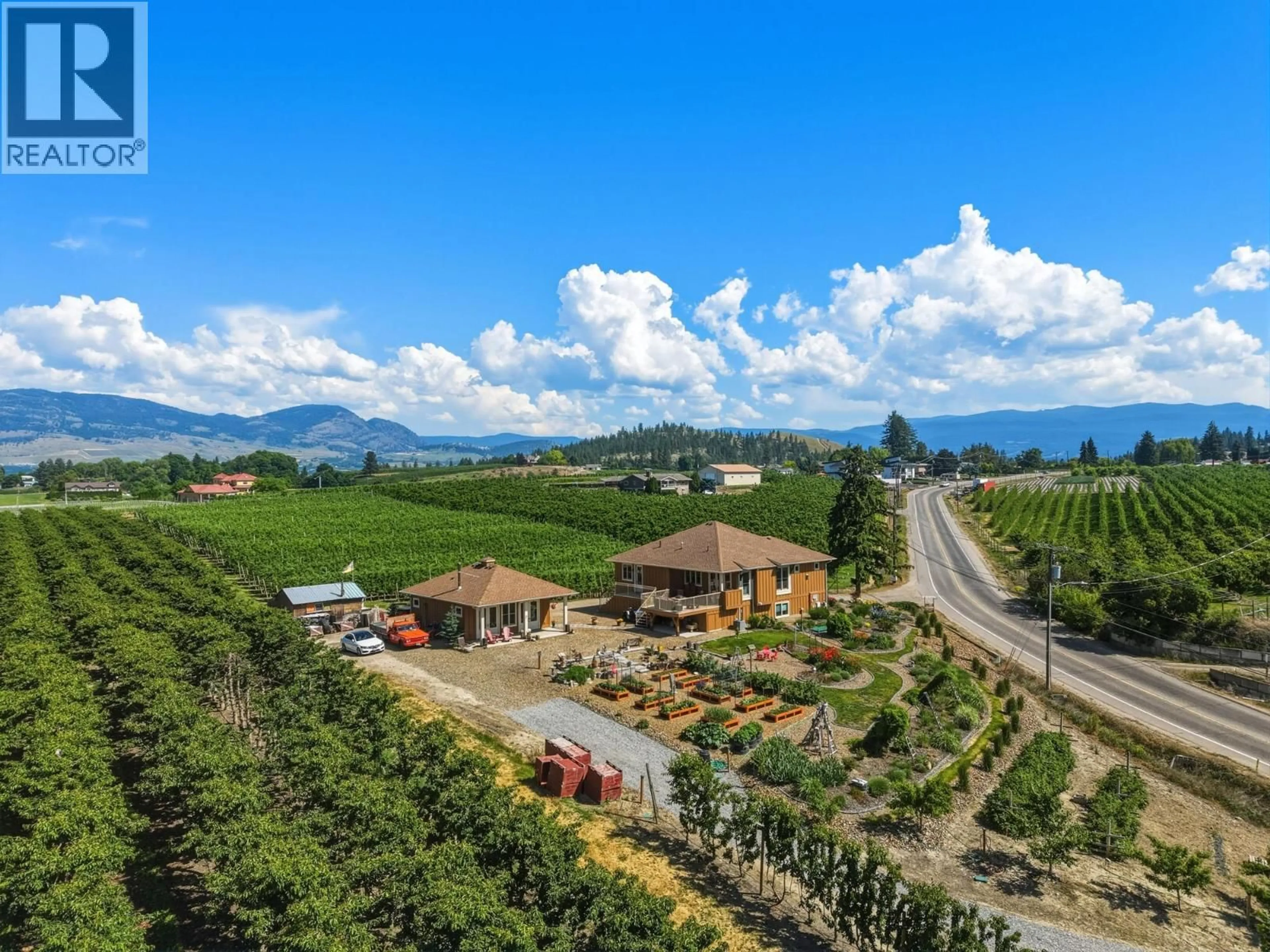 A pic from outside/outdoor area/front of a property/back of a property/a pic from drone, mountain view for 2400 LONGHILL ROAD, Kelowna British Columbia V1V2G3