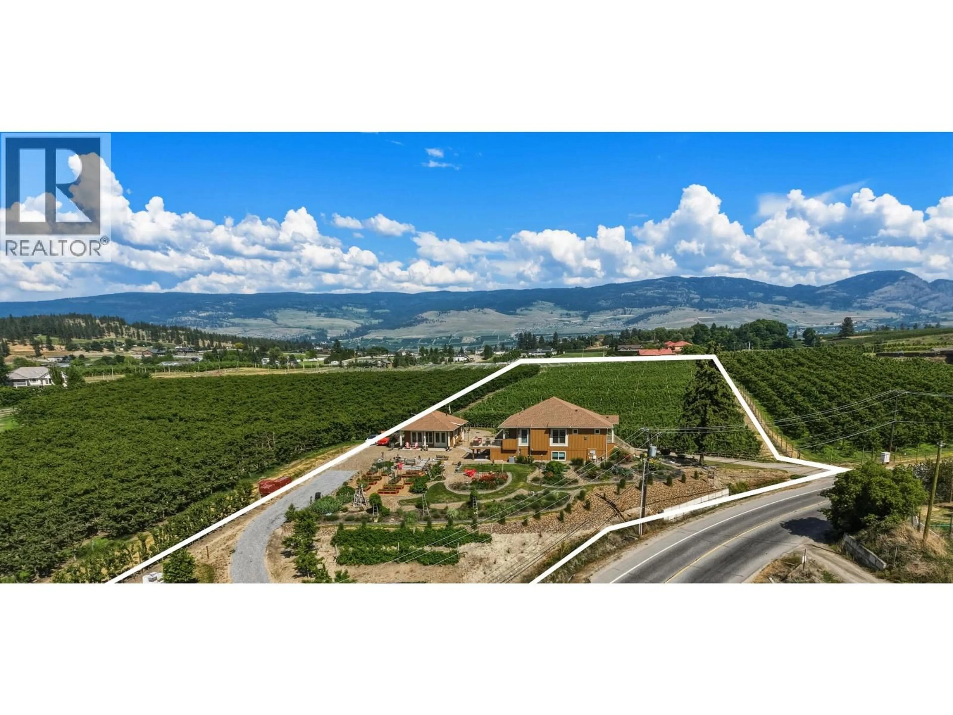 A pic from outside/outdoor area/front of a property/back of a property/a pic from drone, mountain view for 2400 LONGHILL ROAD, Kelowna British Columbia V1V2G3