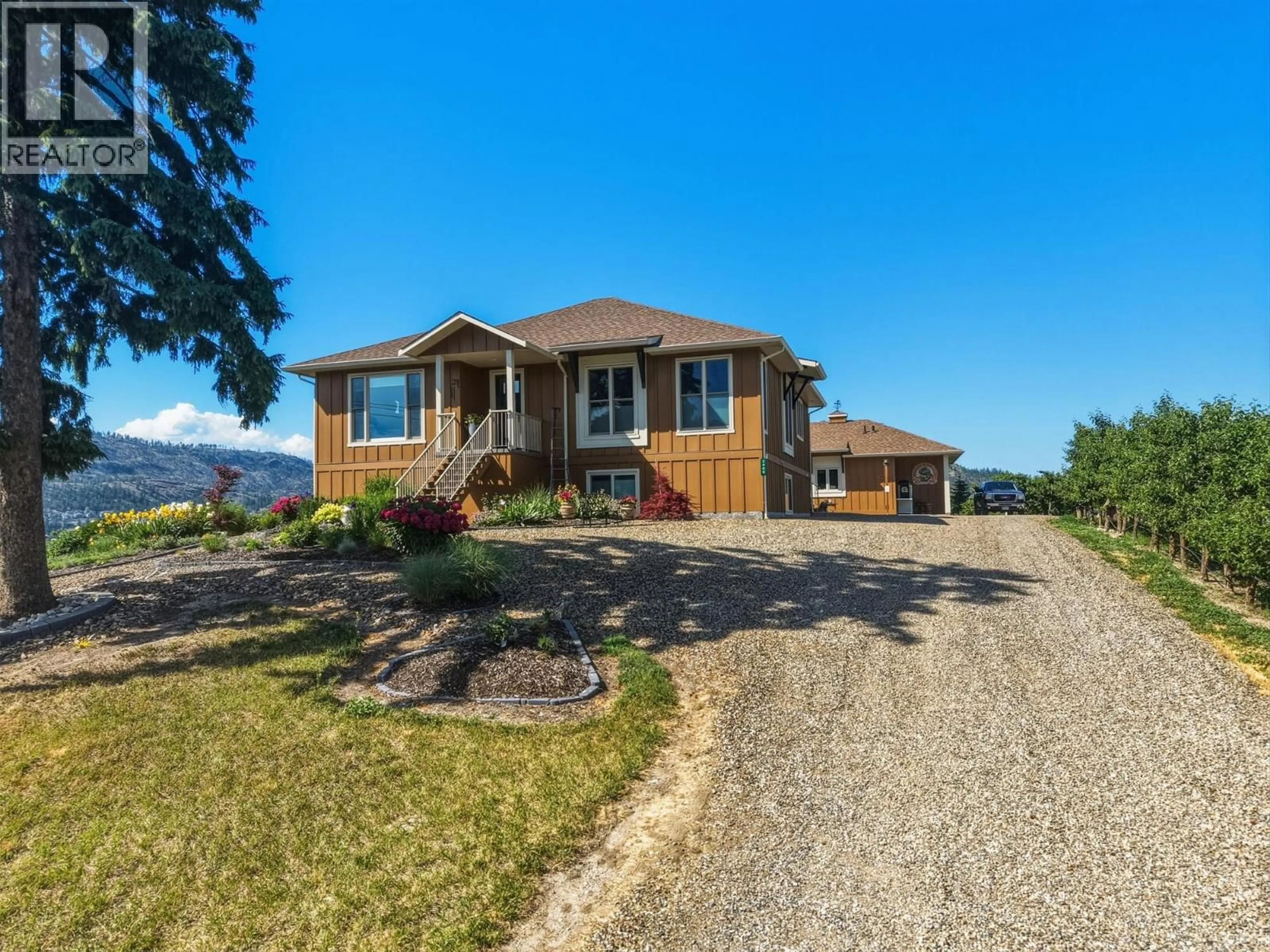 A pic from outside/outdoor area/front of a property/back of a property/a pic from drone, unknown for 2400 LONGHILL ROAD, Kelowna British Columbia V1V2G3