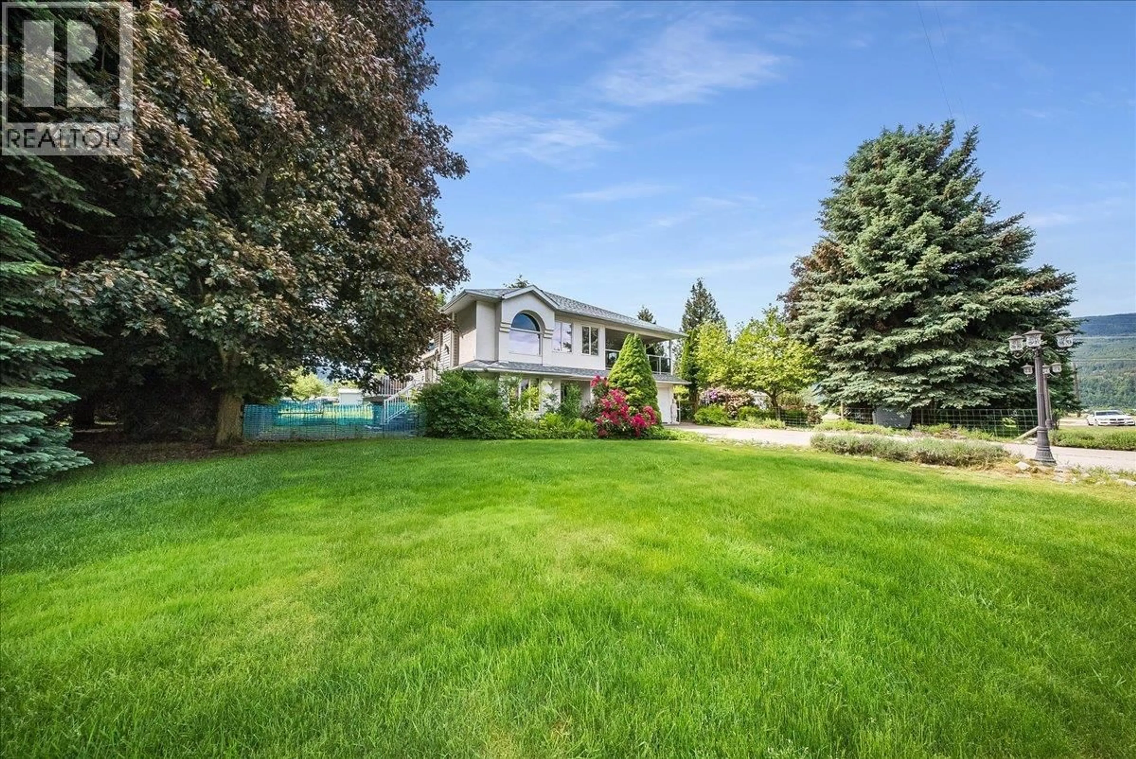 A pic from outside/outdoor area/front of a property/back of a property/a pic from drone, street for 1545 COLUMBIA ROAD, Ootischenia British Columbia V1N4L6