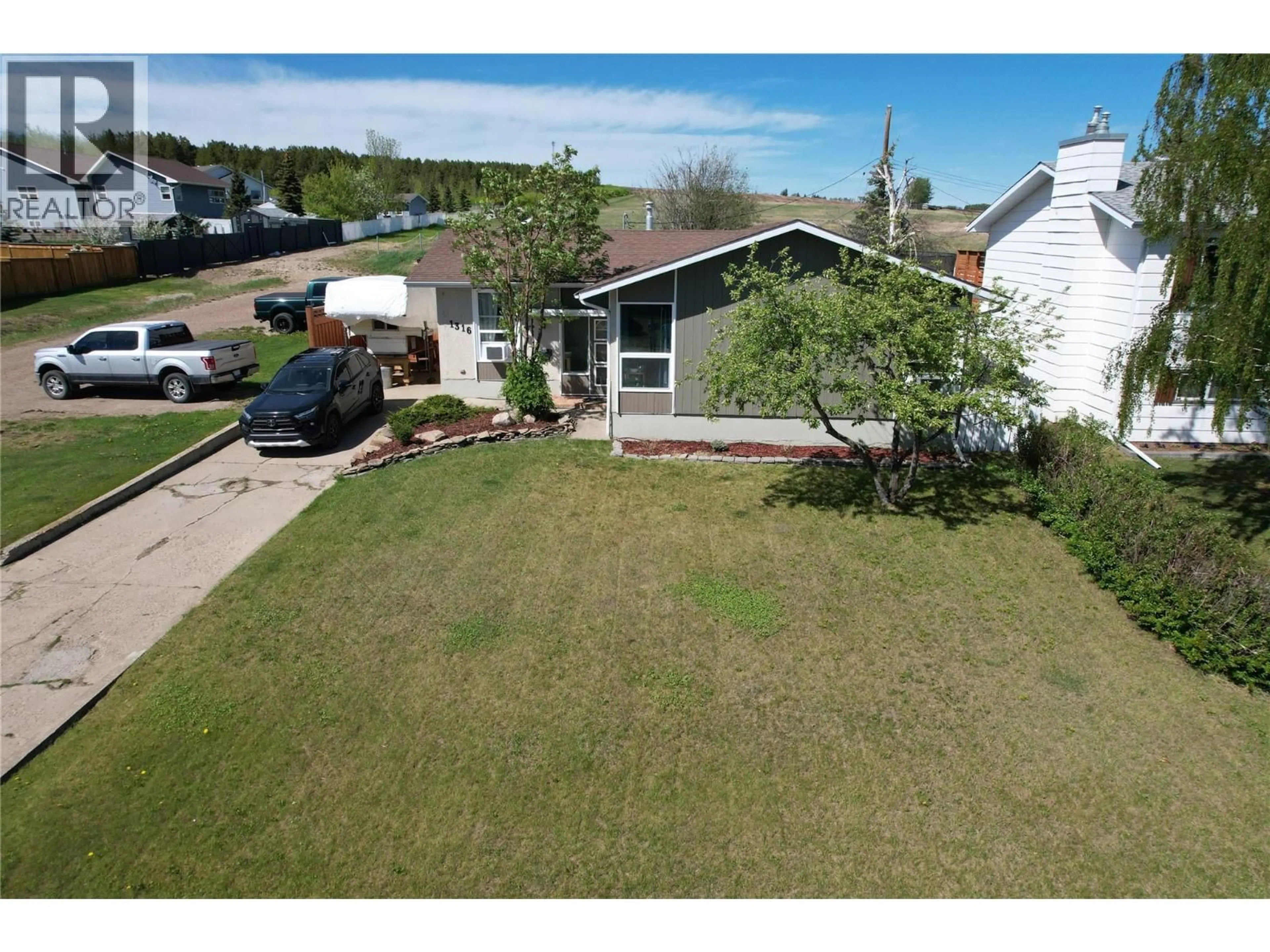 A pic from outside/outdoor area/front of a property/back of a property/a pic from drone, street for 1316 92 AVENUE, Dawson Creek British Columbia V1G1C3
