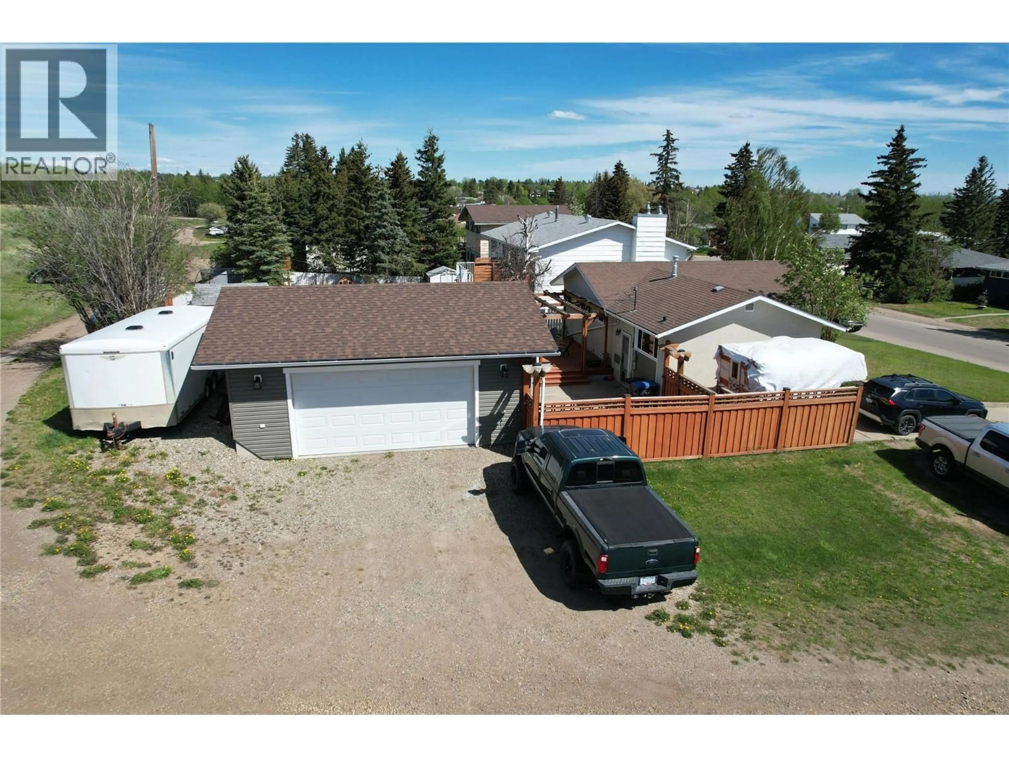 A pic from outside/outdoor area/front of a property/back of a property/a pic from drone, street for 1316 92 AVENUE, Dawson Creek British Columbia V1G1C3