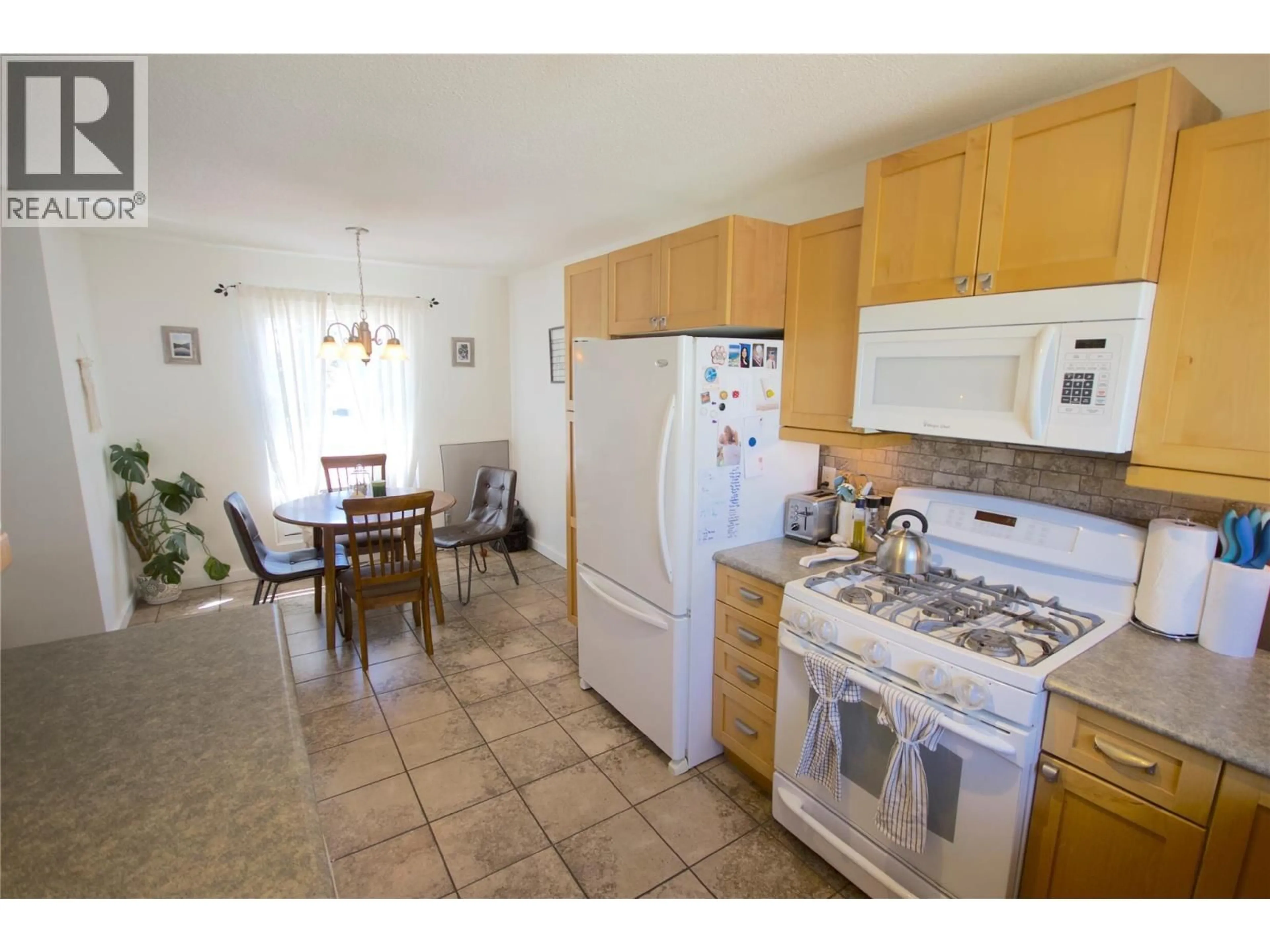 Standard kitchen, ceramic/tile floor for 1316 92 AVENUE, Dawson Creek British Columbia V1G1C3