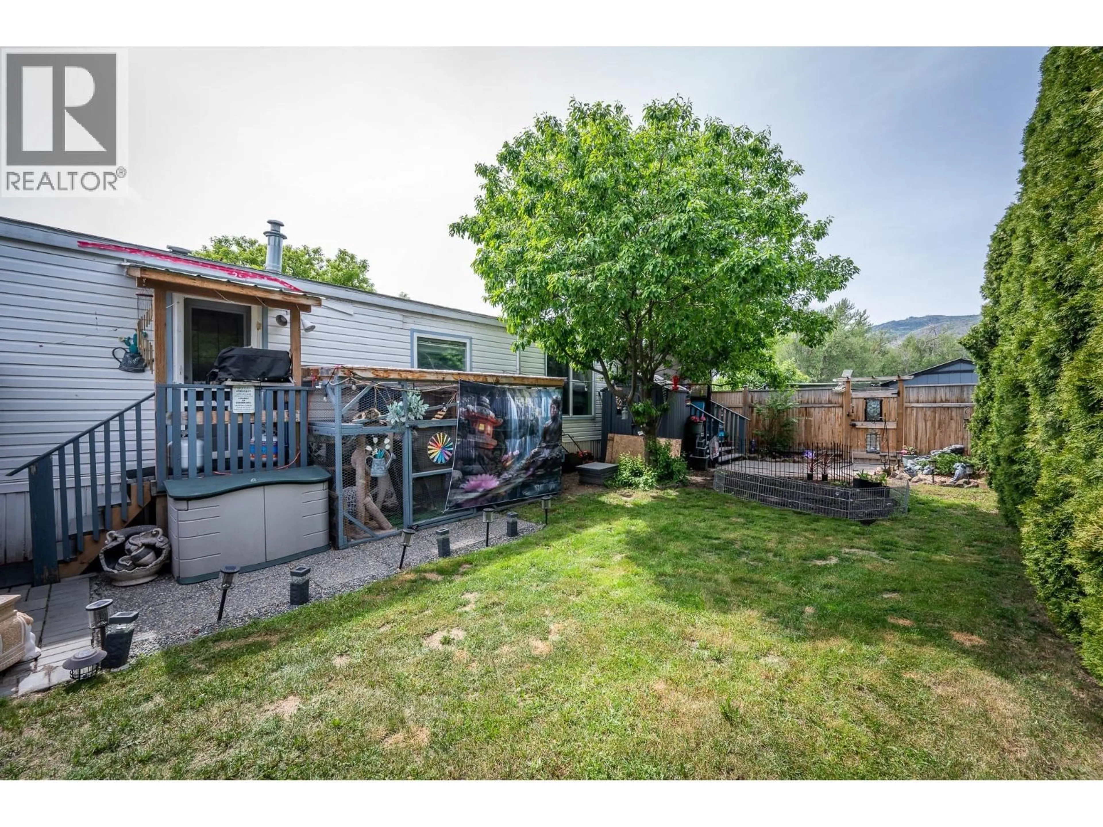 A pic from outside/outdoor area/front of a property/back of a property/a pic from drone, mountain view for 103 - 4796 TRANS CANADA HIGHWAY WEST, Kamloops British Columbia V1S2A8