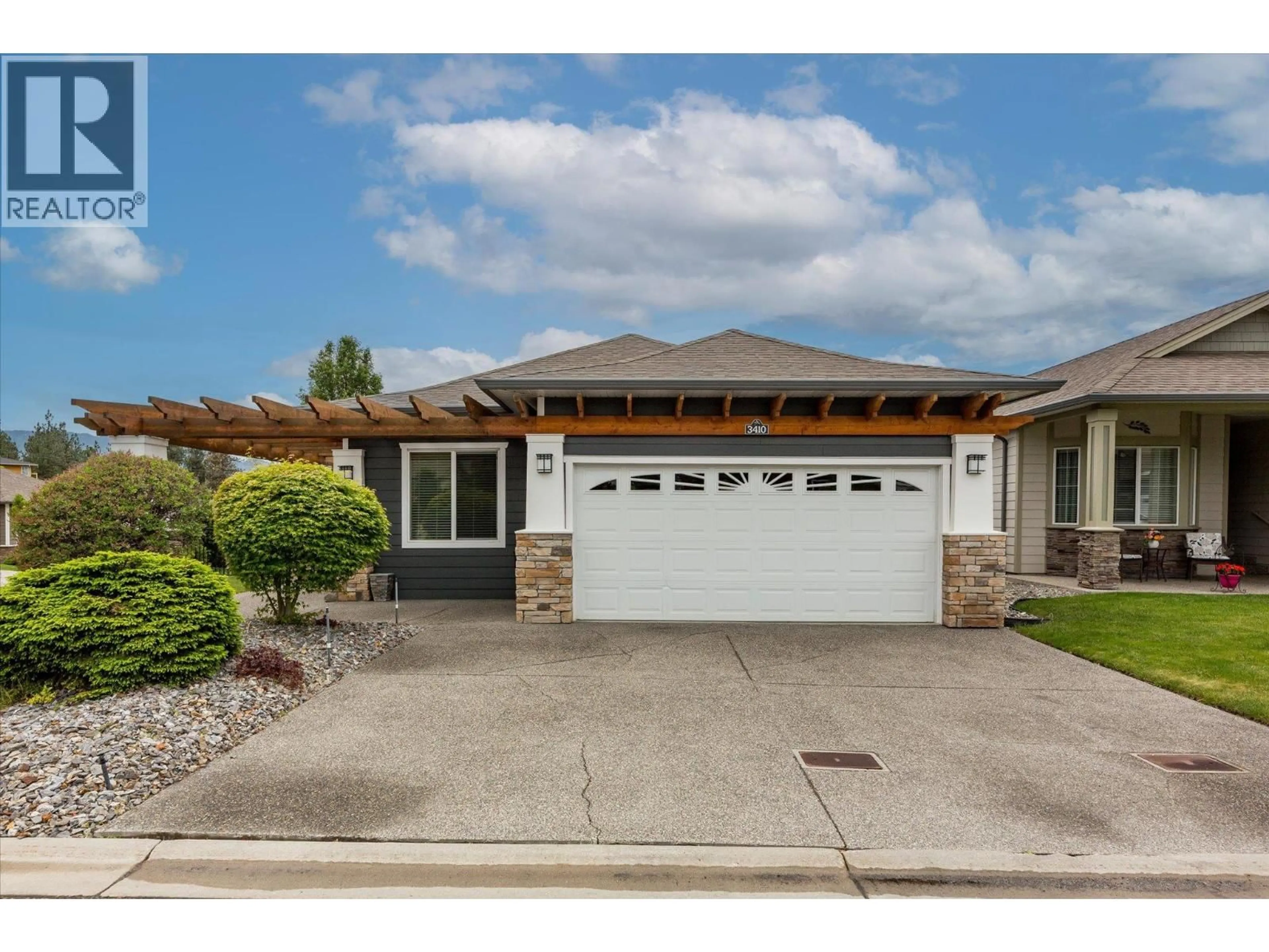 Home with vinyl exterior material, street for 3410 KINGFISHER ROAD, West Kelowna British Columbia V4T3A5