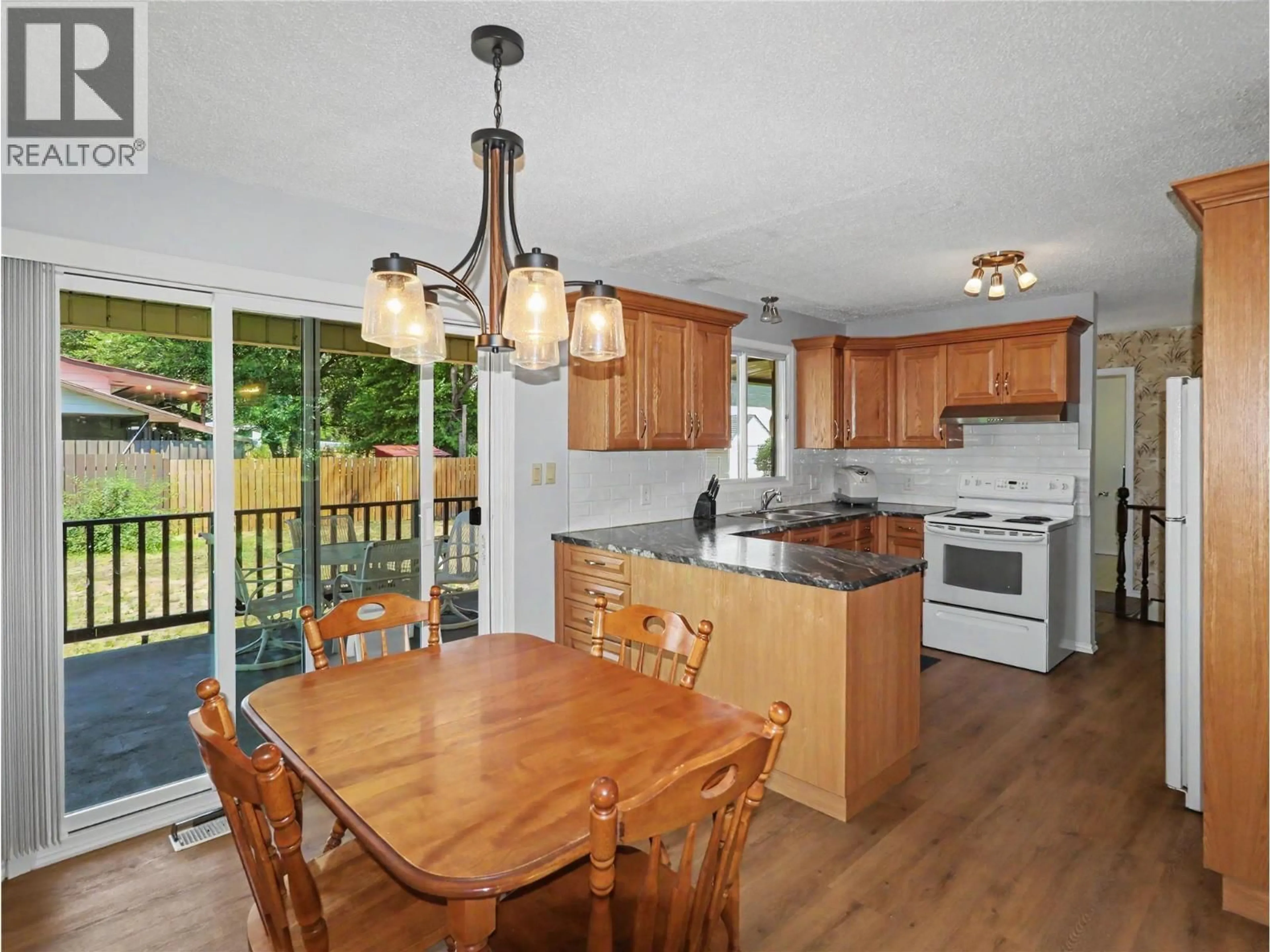 Open concept kitchen, wood/laminate floor for 1383 68TH AVENUE, Grand Forks British Columbia V0H1H0
