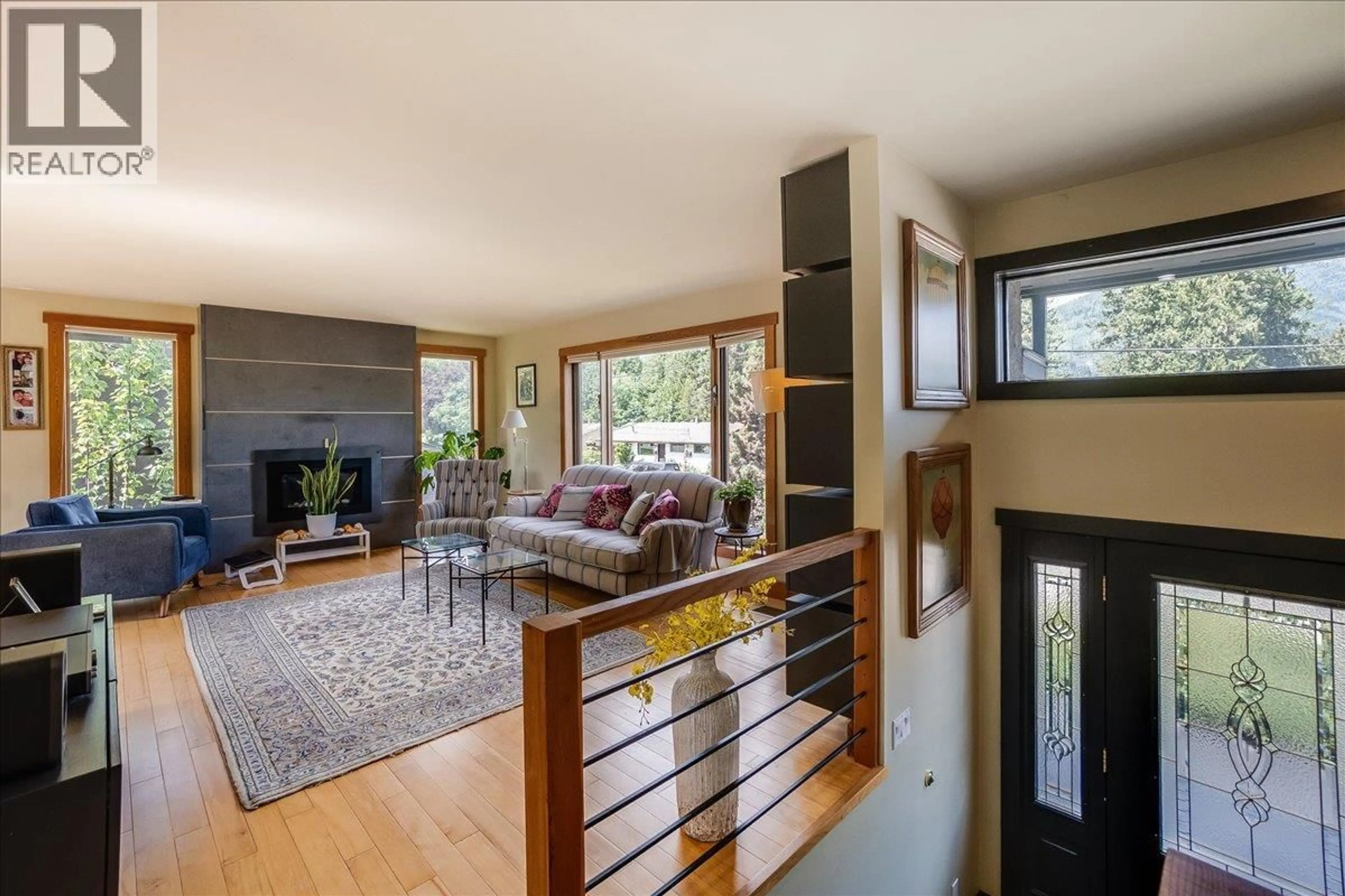 Living room with furniture, wood/laminate floor for 1001 GILKER STREET, Nelson British Columbia V1L5V3