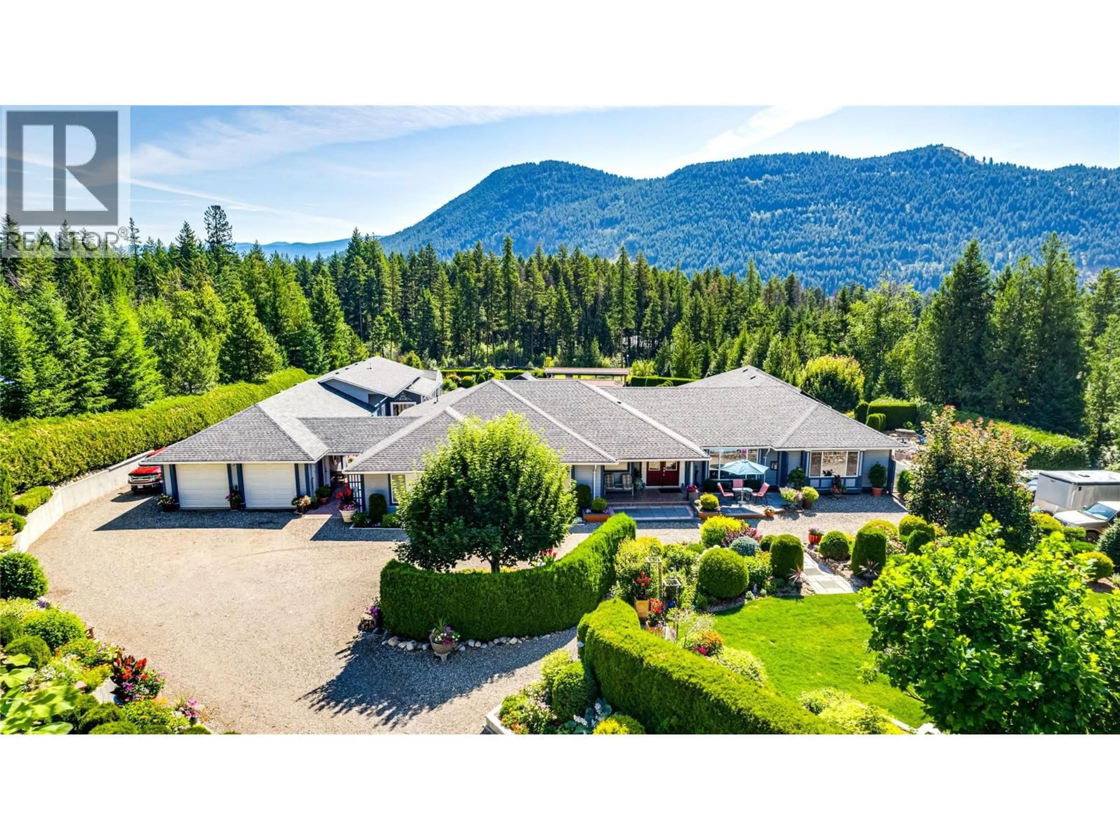 A pic from outside/outdoor area/front of a property/back of a property/a pic from drone, mountain view for 39 LADYSLIPPER ROAD, Lumby British Columbia V0E2G5