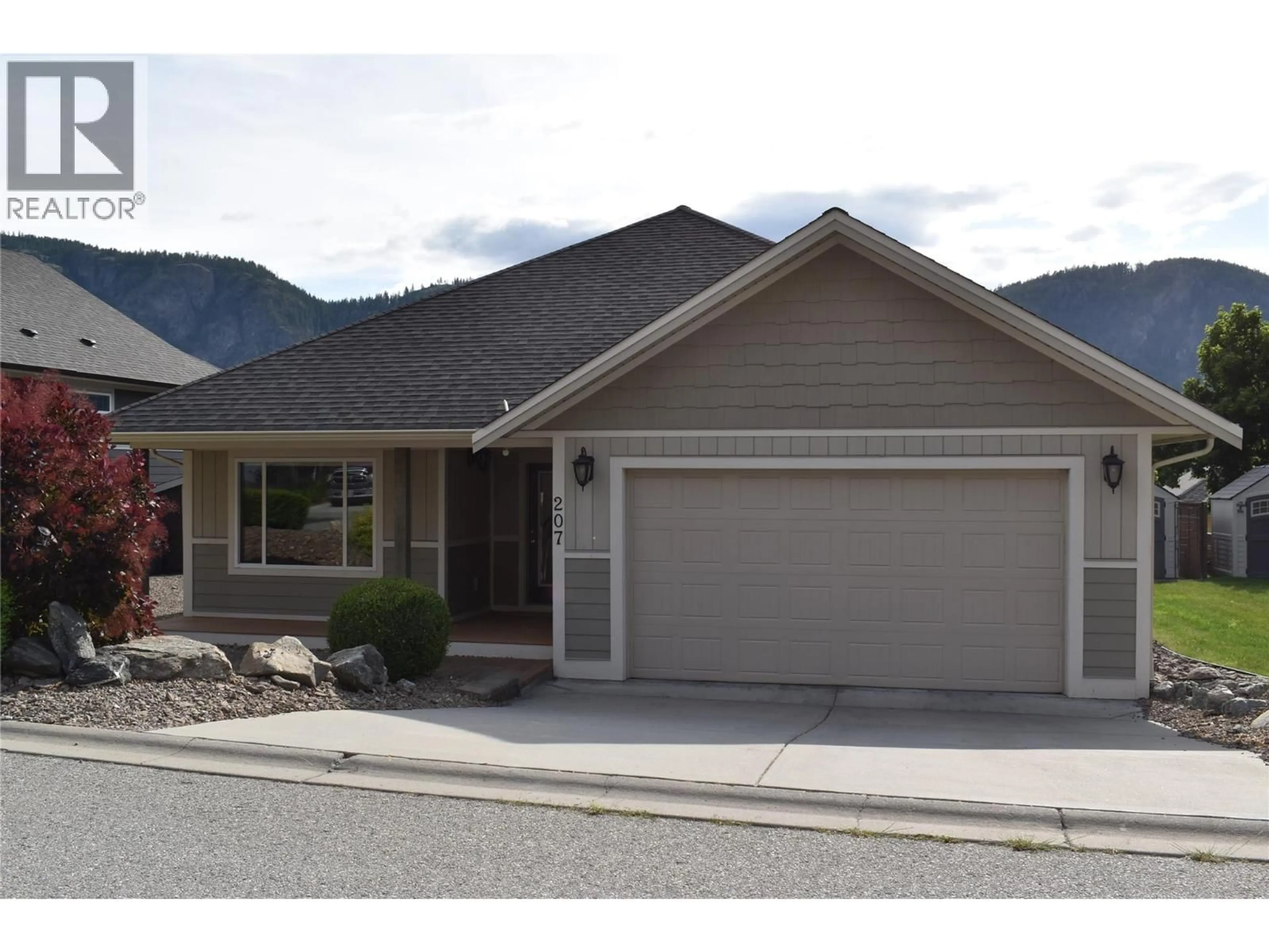 Home with vinyl exterior material, street for 207 - 4400 MCLEAN CREEK ROAD, Okanagan Falls British Columbia V0H1R6