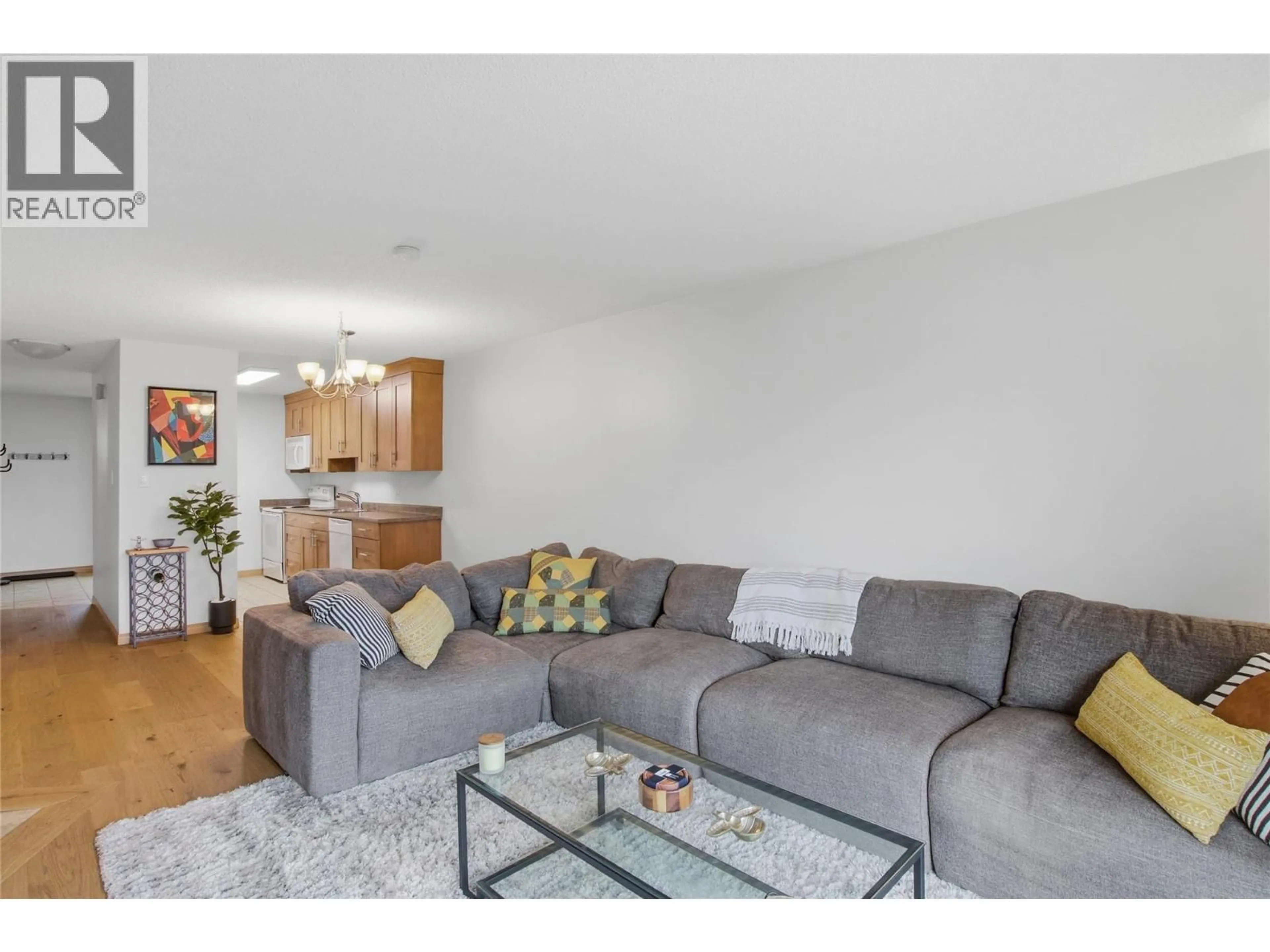 Living room with furniture, wood/laminate floor for 82 - 1750 SUMMIT DRIVE, Kamloops British Columbia V2E1Y1