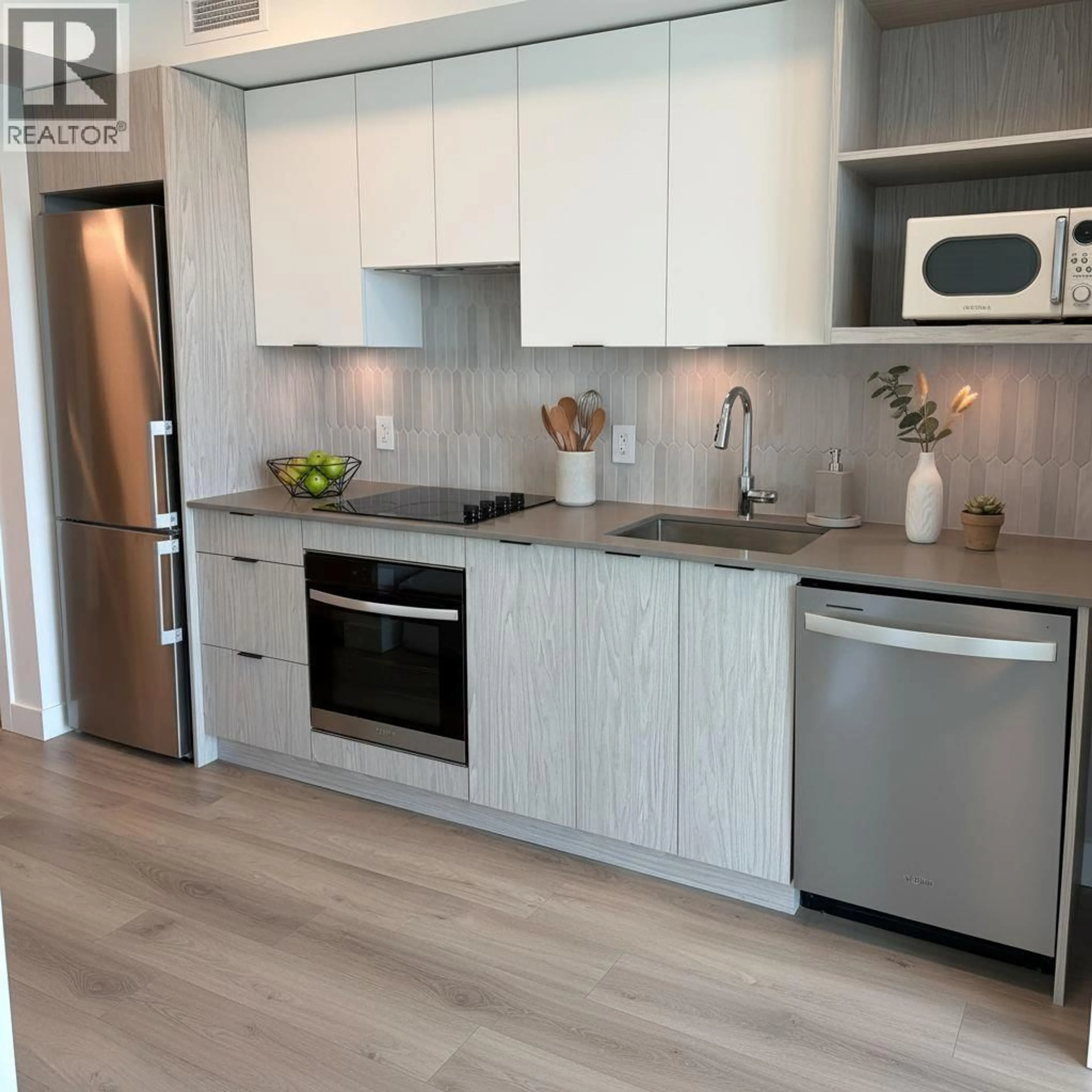 Open concept kitchen, wood/laminate floor for 1706 - 1488 BERTRAM STREET, Kelowna British Columbia V1Y6P2