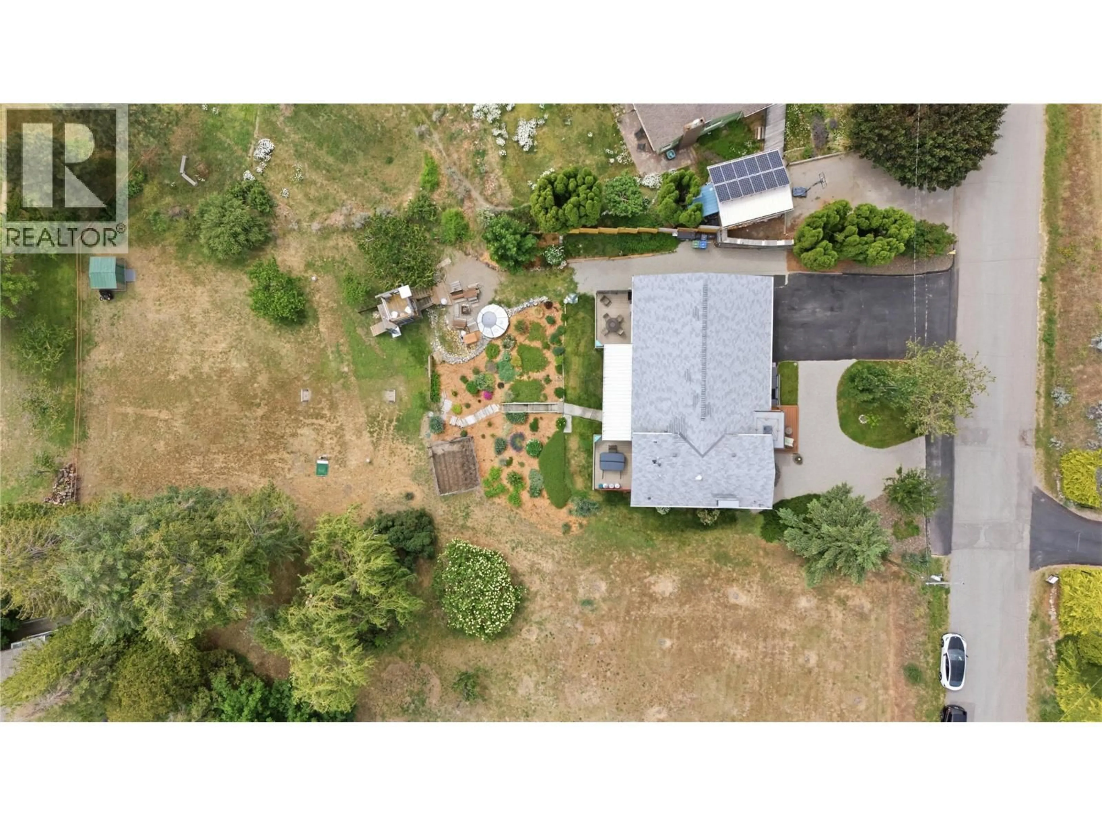 A pic from outside/outdoor area/front of a property/back of a property/a pic from drone, unknown for 1019 VETERAN DRIVE, Penticton British Columbia V2A7K8