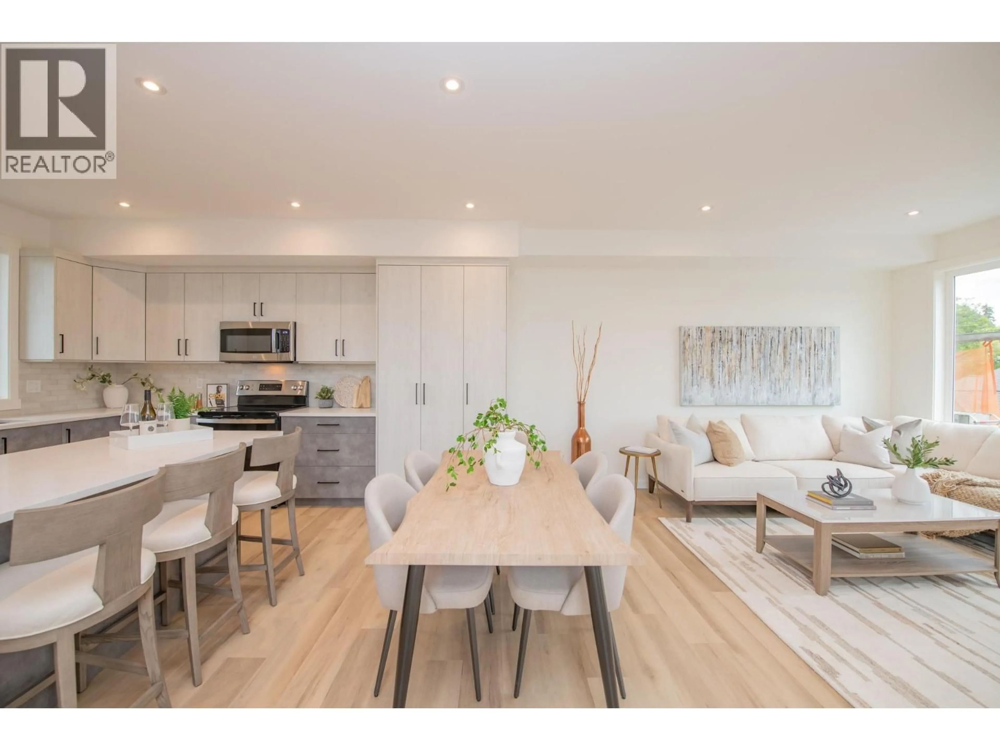 Open concept kitchen, wood/laminate floor for 1 - 3602 PLEASANT VALLEY ROAD, Vernon British Columbia V1T4L6