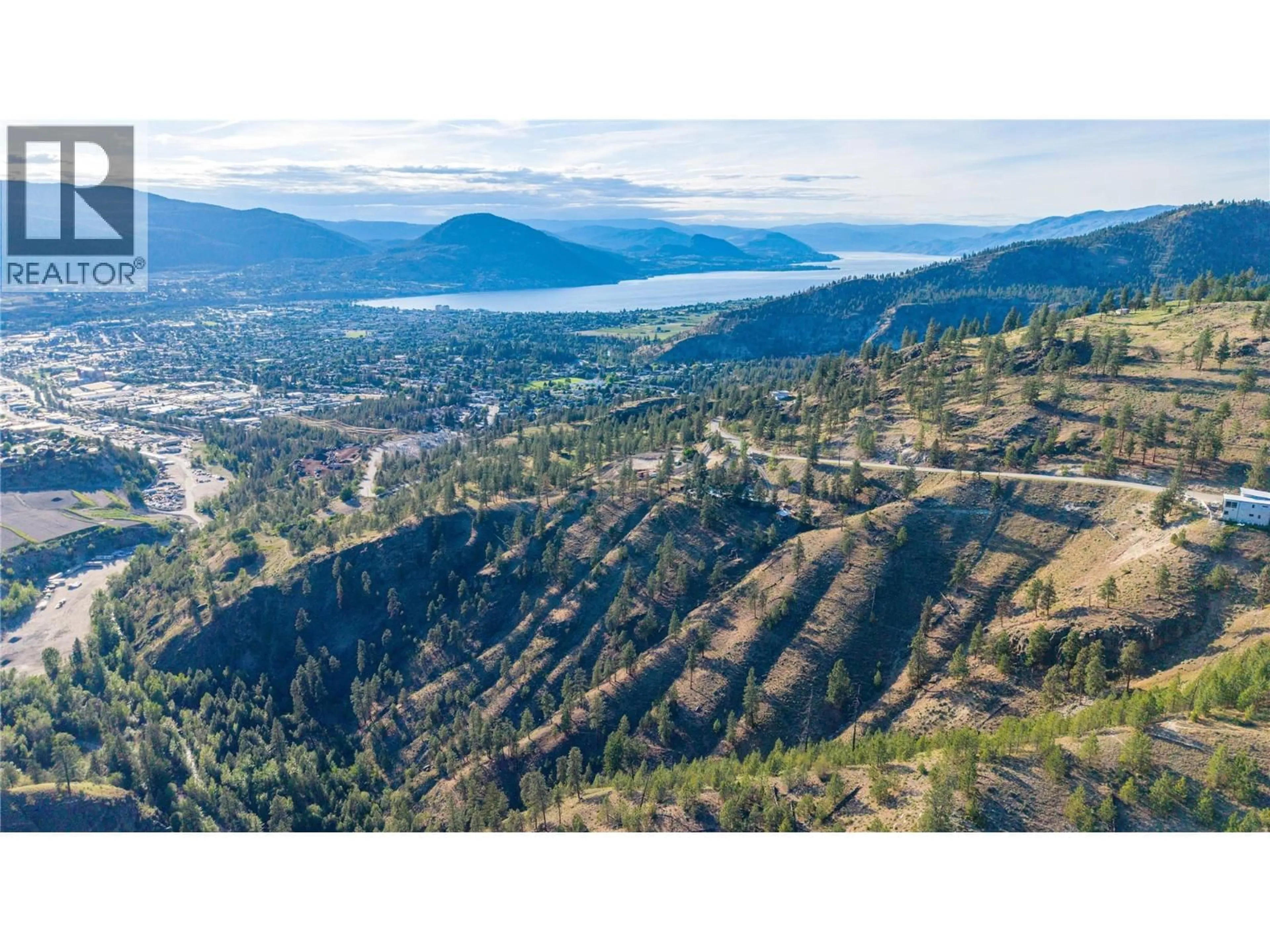 A pic from outside/outdoor area/front of a property/back of a property/a pic from drone, mountain view for 158 SALIKEN DRIVE, Penticton British Columbia V2A8V6
