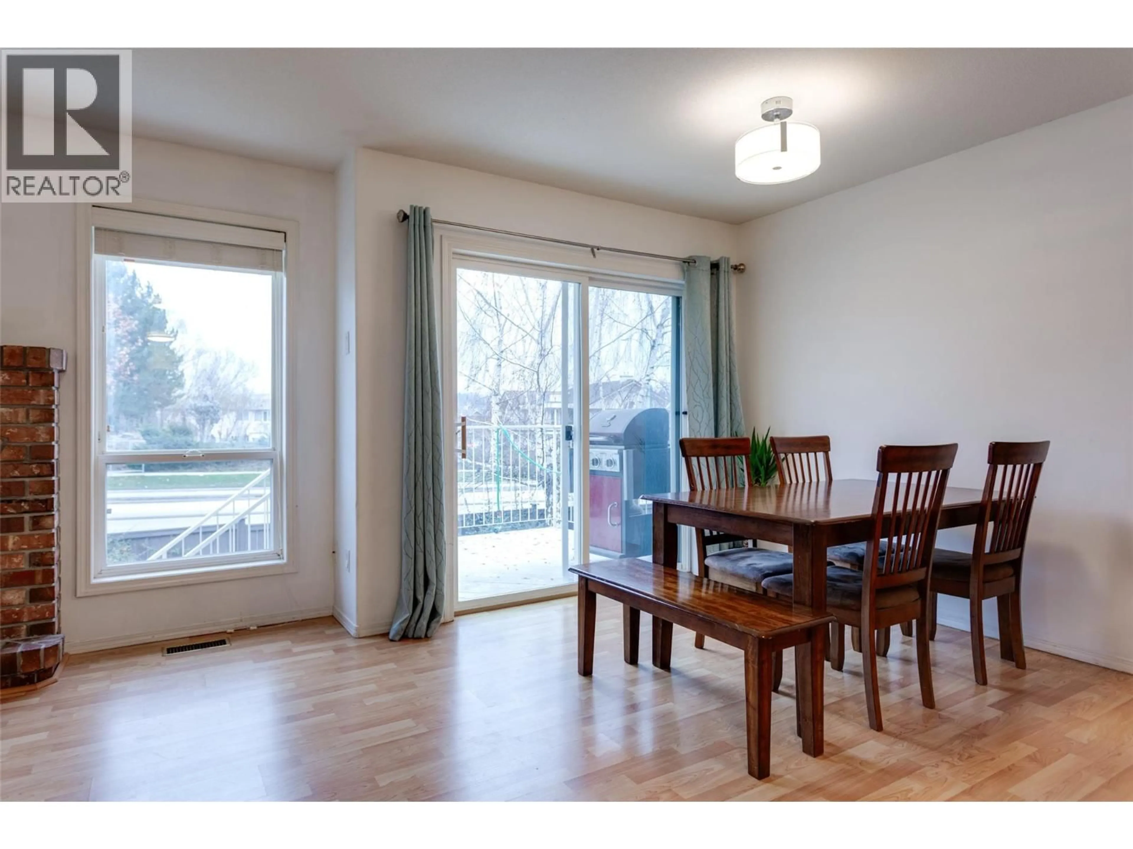 Dining room, wood/laminate floor for 115 - 133 WYNDHAM CRESCENT, Kelowna British Columbia V1V1Y8