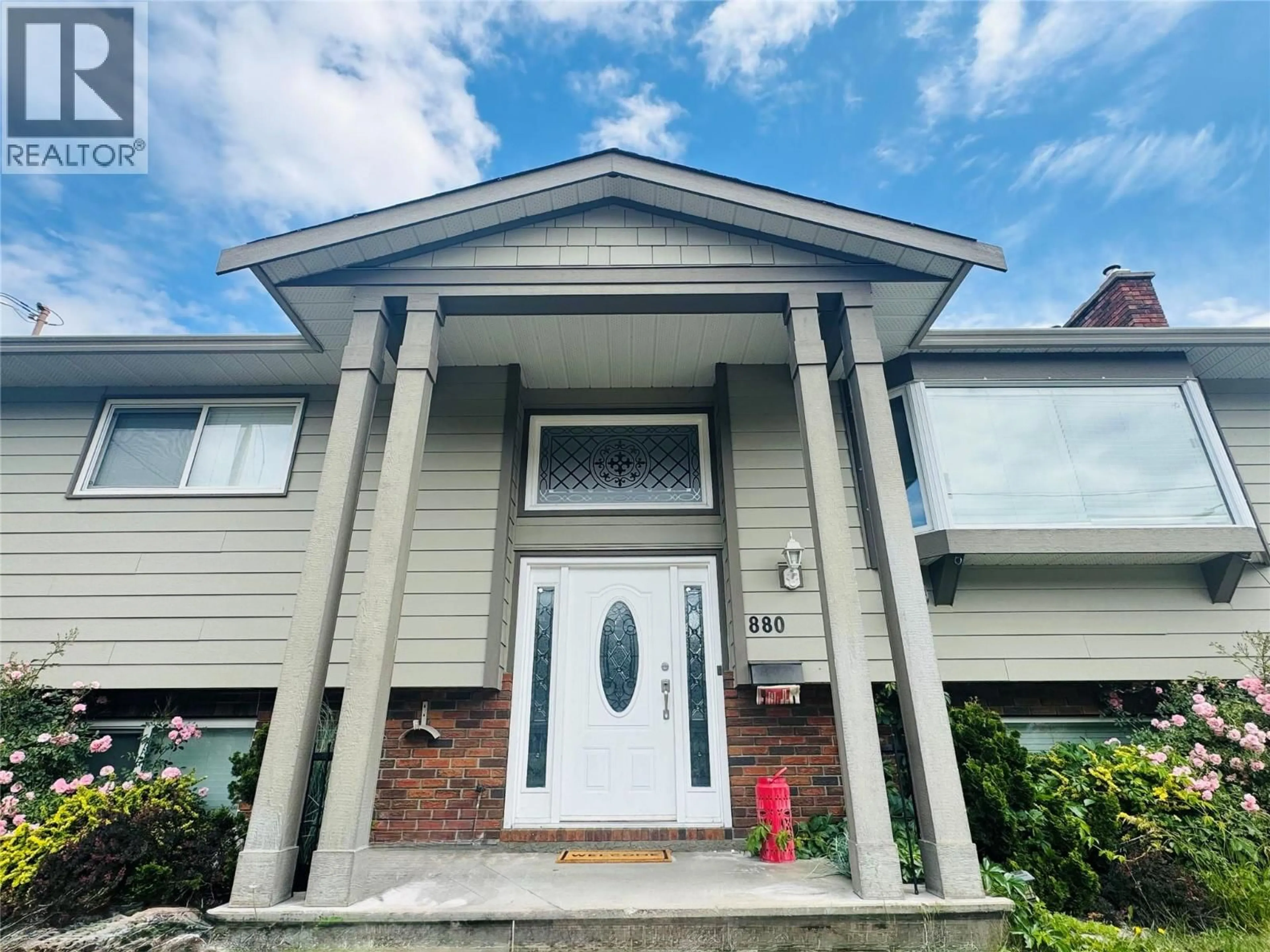 Home with vinyl exterior material, street for 880 TAMARACK DRIVE, Kelowna British Columbia V1X5M1
