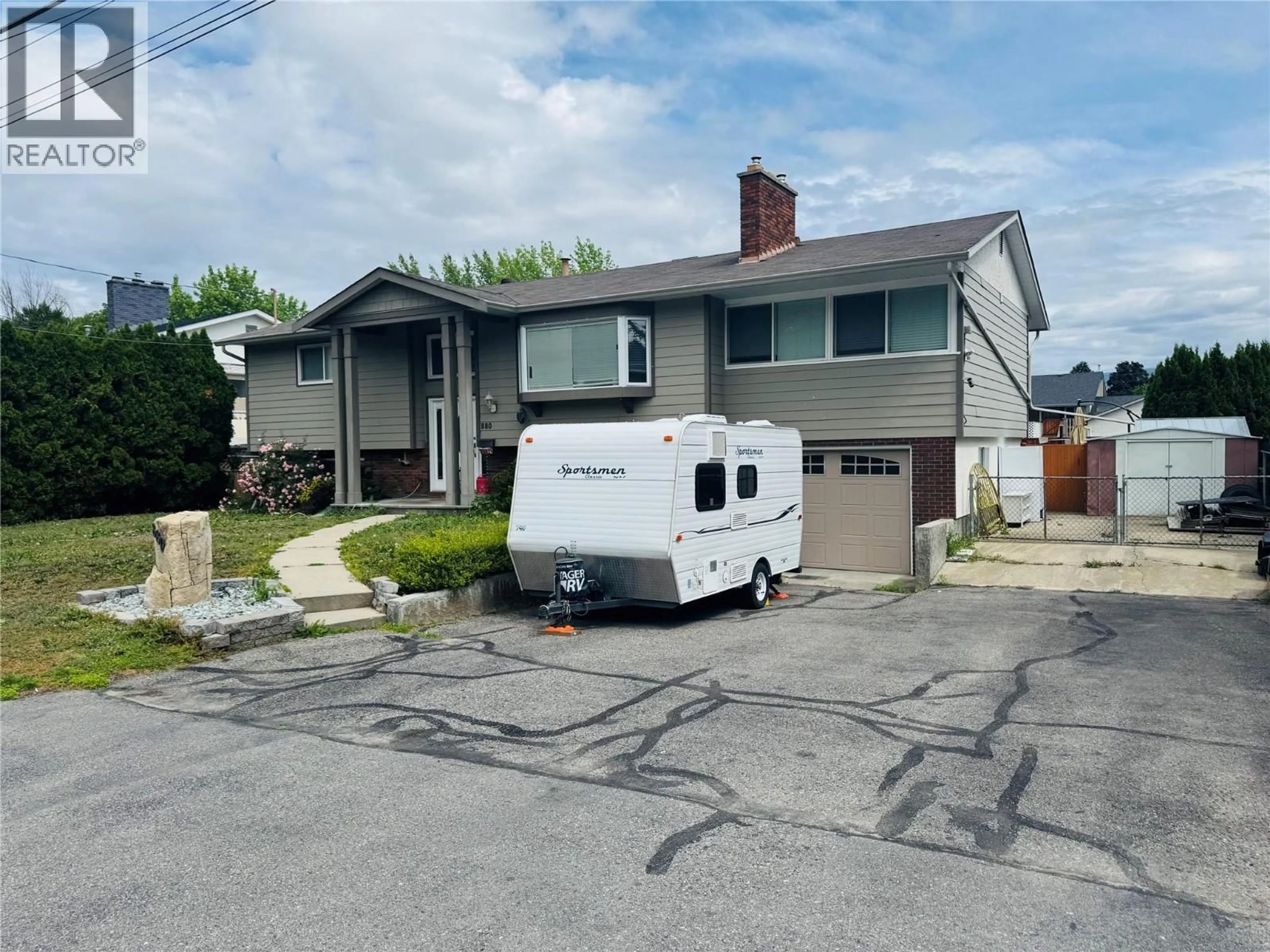 Home with vinyl exterior material, street for 880 TAMARACK DRIVE, Kelowna British Columbia V1X5M1