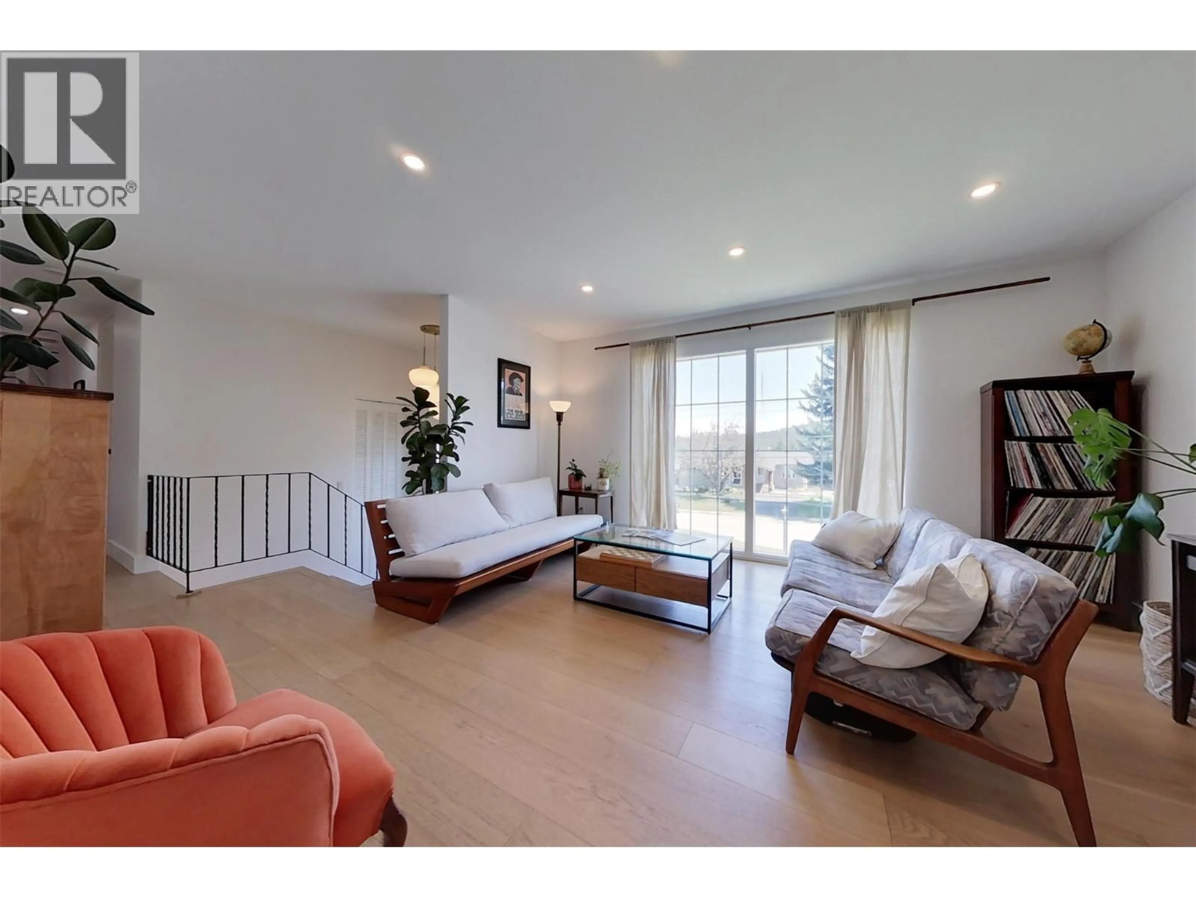 Living room with furniture, wood/laminate floor for 129 LEVIRS AVENUE, Kimberley British Columbia V1A1X6