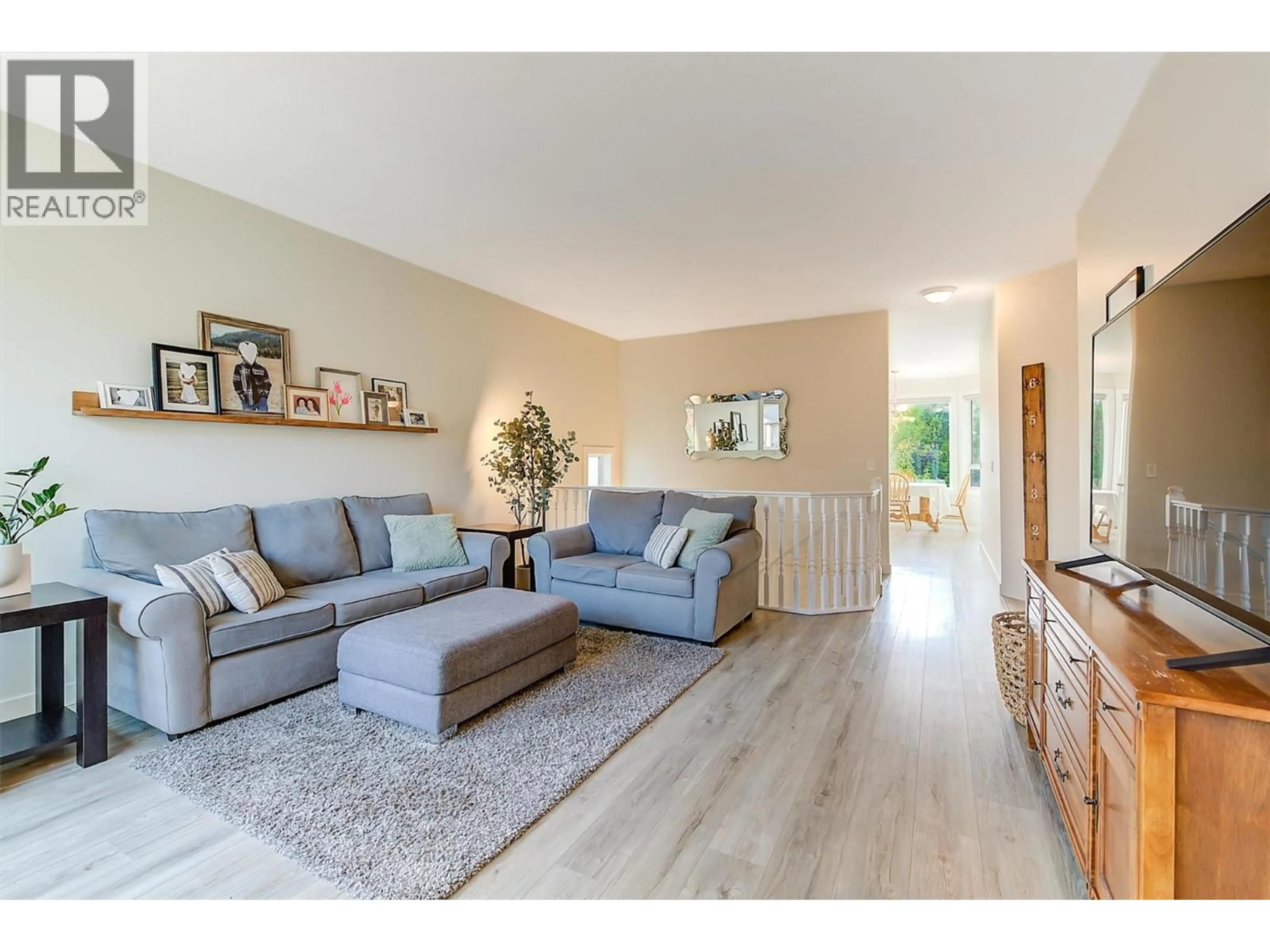 Living room with furniture, wood/laminate floor for 2083 ROSEFIELD DRIVE, West Kelowna British Columbia V1Z3Y8