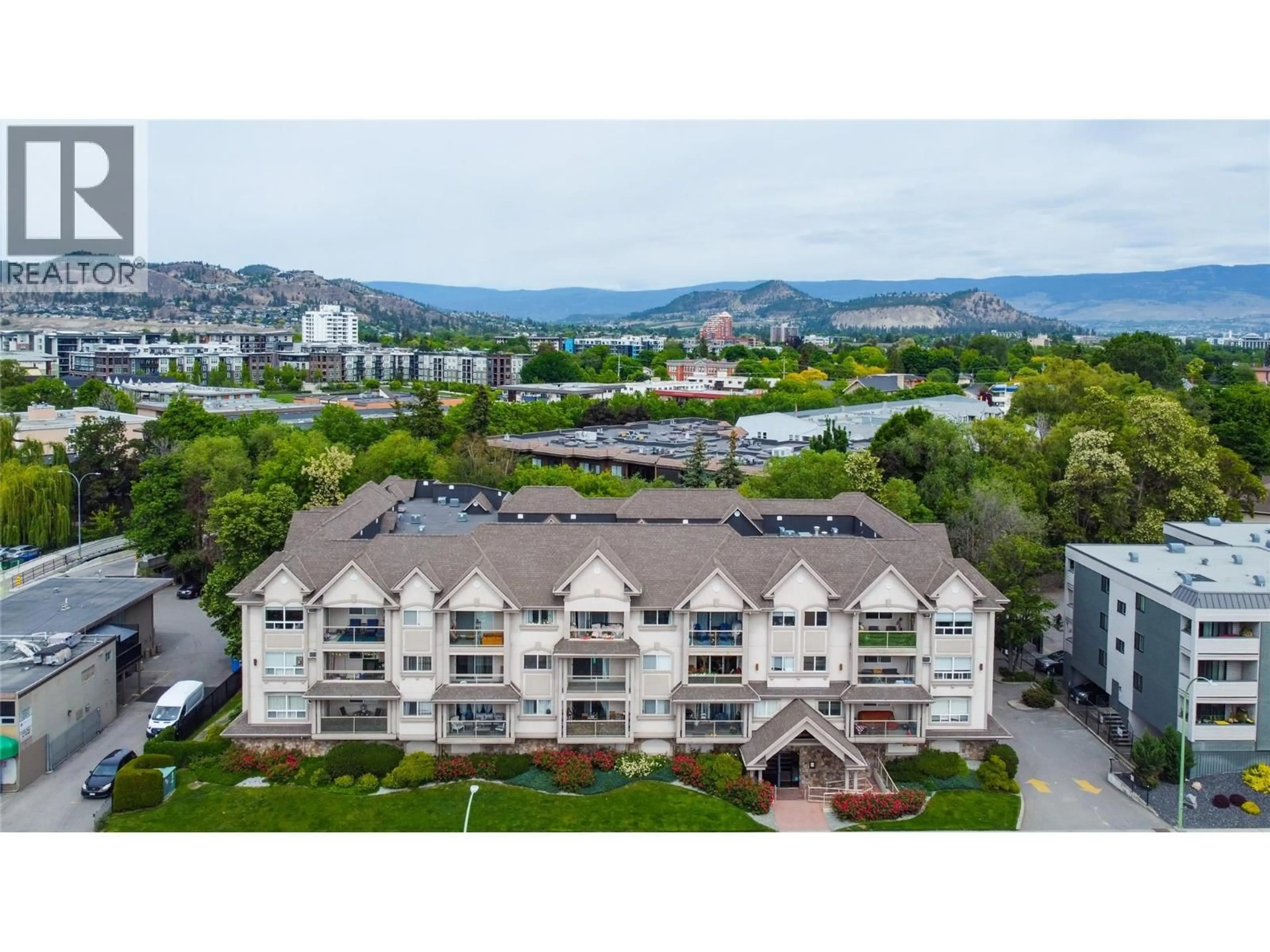 A pic from outside/outdoor area/front of a property/back of a property/a pic from drone, mountain view for 105 - 1965 PANDOSY STREET, Kelowna British Columbia V1Y1R9
