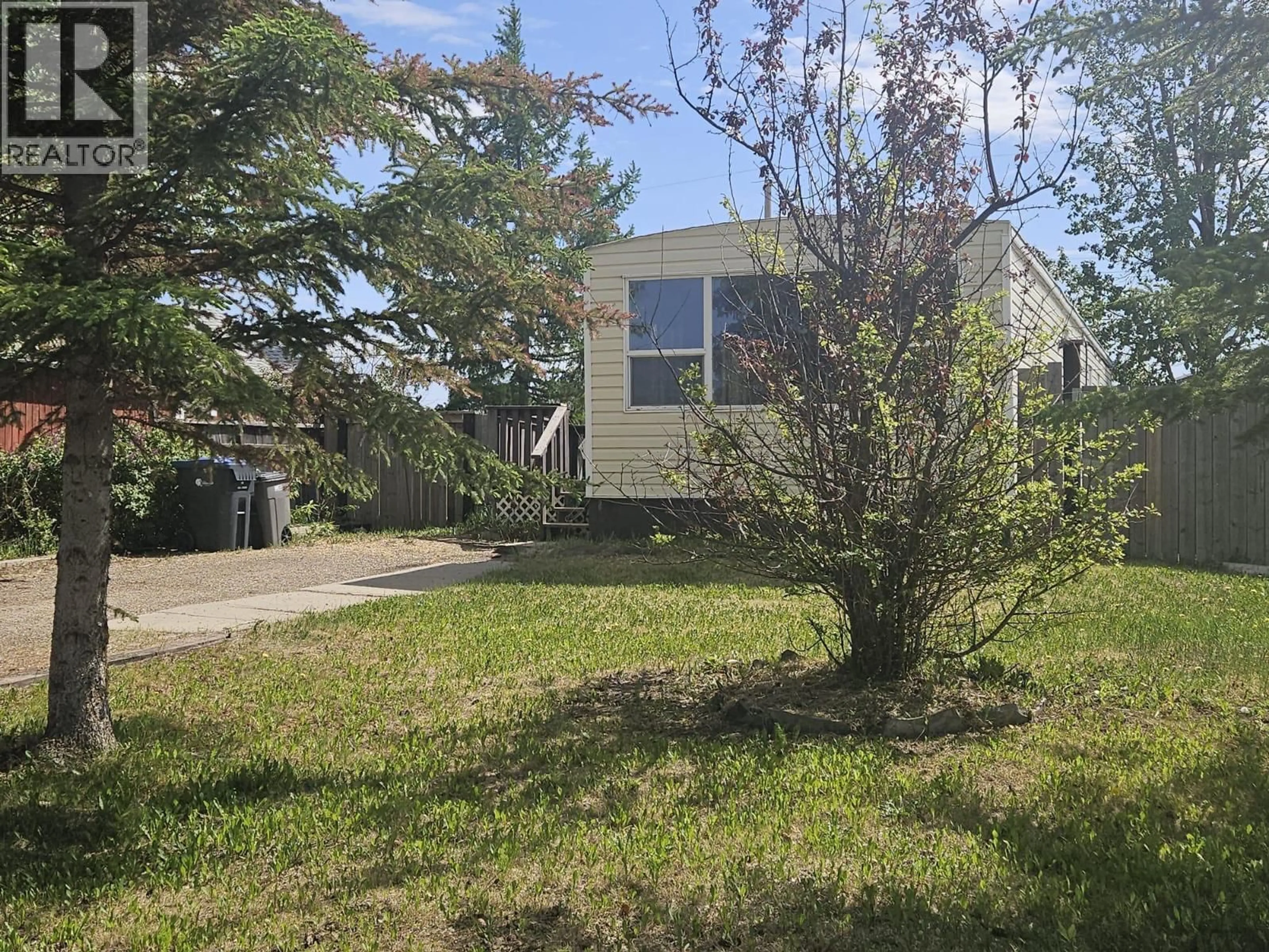 A pic from outside/outdoor area/front of a property/back of a property/a pic from drone, street for 921 121 AVENUE, Dawson Creek British Columbia V1G3K3