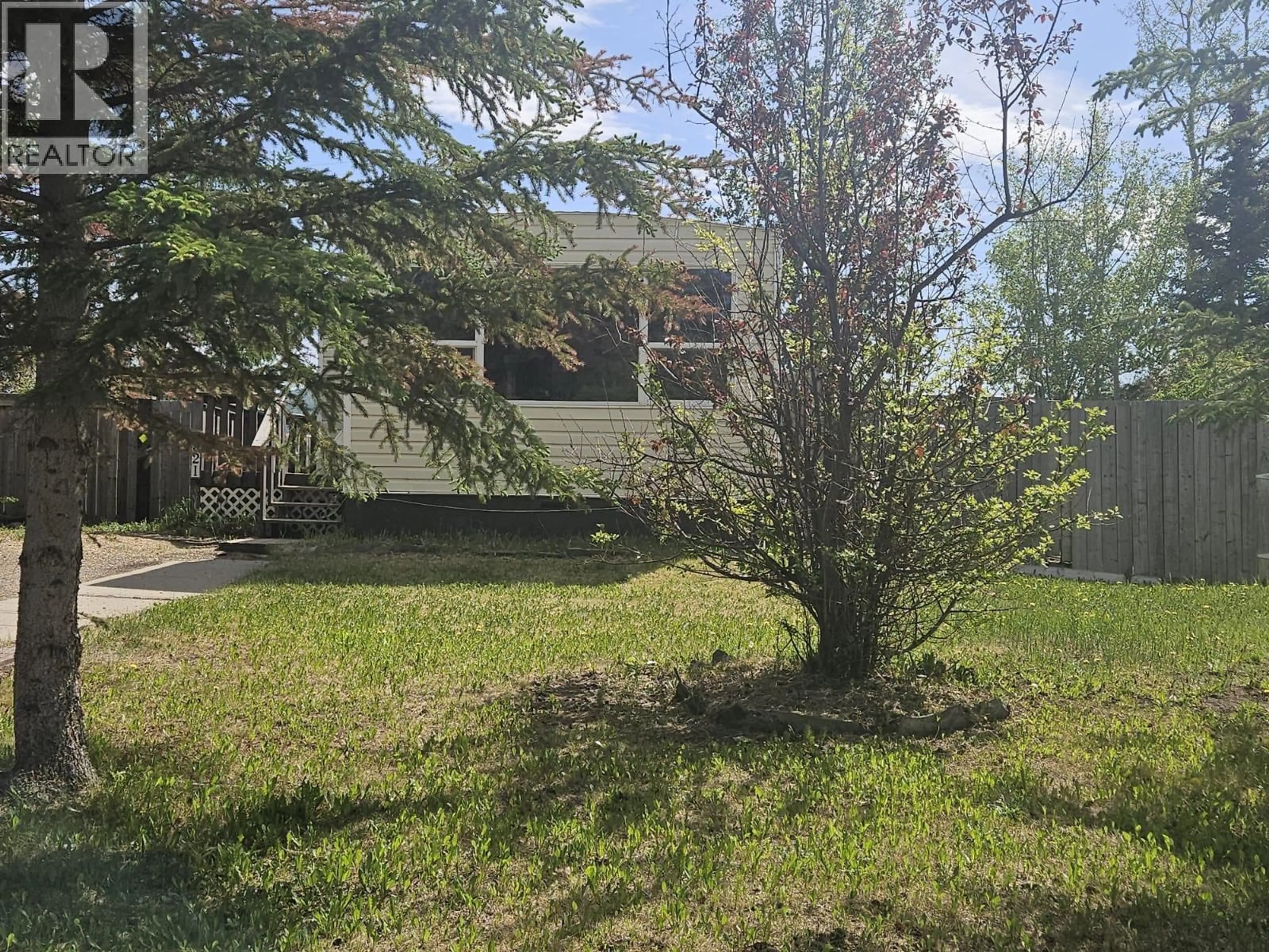 A pic from outside/outdoor area/front of a property/back of a property/a pic from drone, unknown for 921 121 AVENUE, Dawson Creek British Columbia V1G3K3