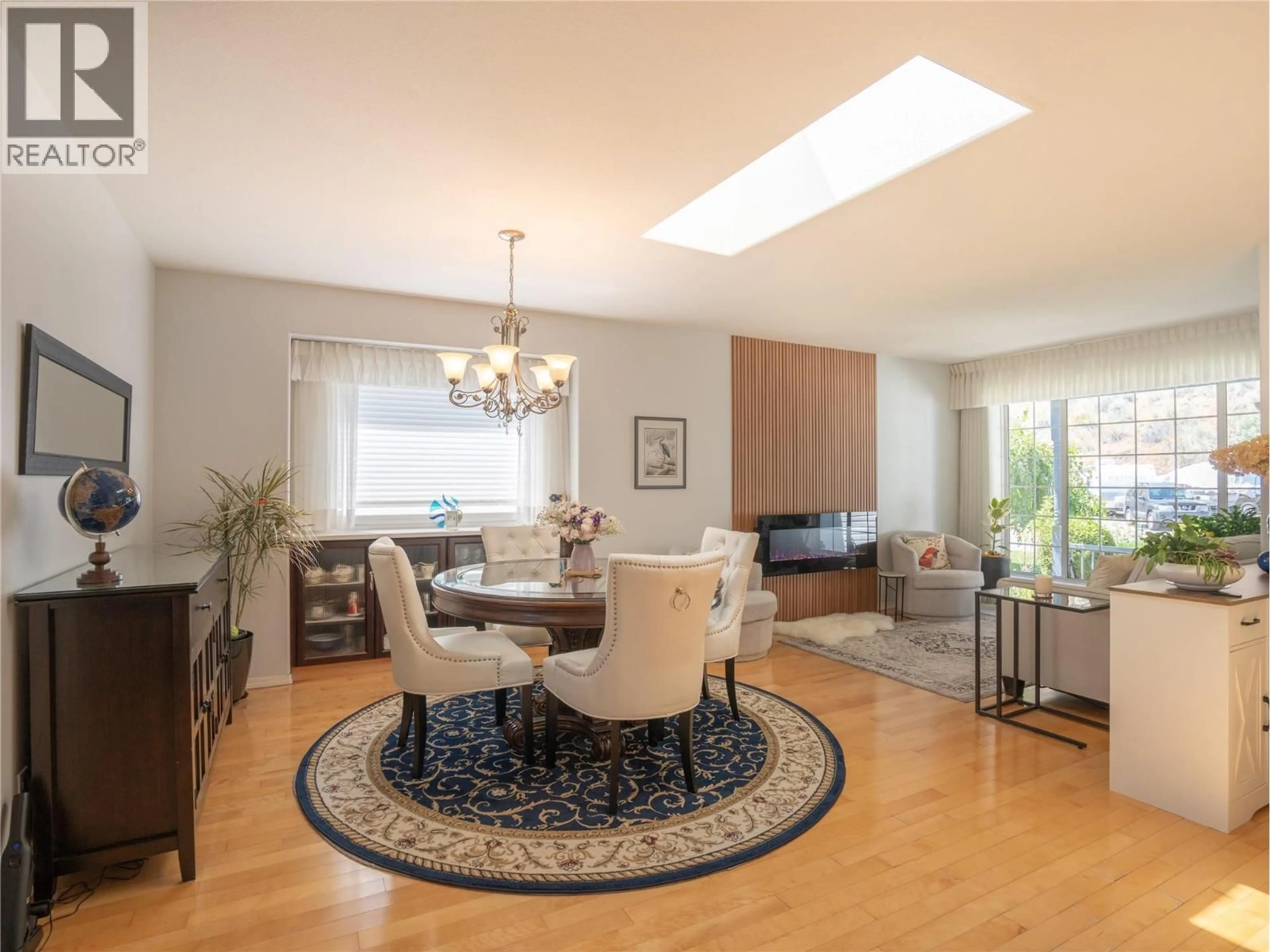 Living room with furniture, wood/laminate floor for 598 RED WING DRIVE, Penticton British Columbia V2A8N7