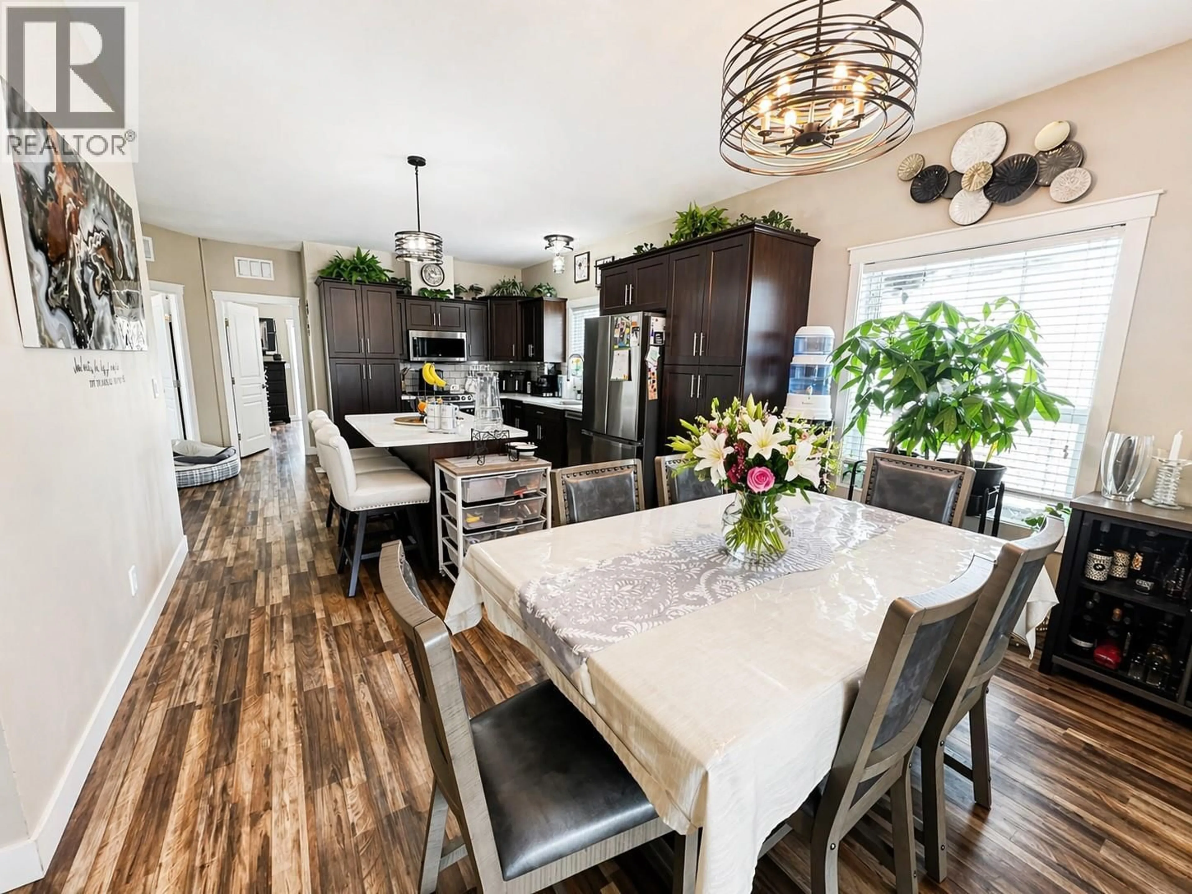 Open concept kitchen, wood/laminate floor for 2599 SPRING BANK AVENUE, Merritt British Columbia V1K1S1