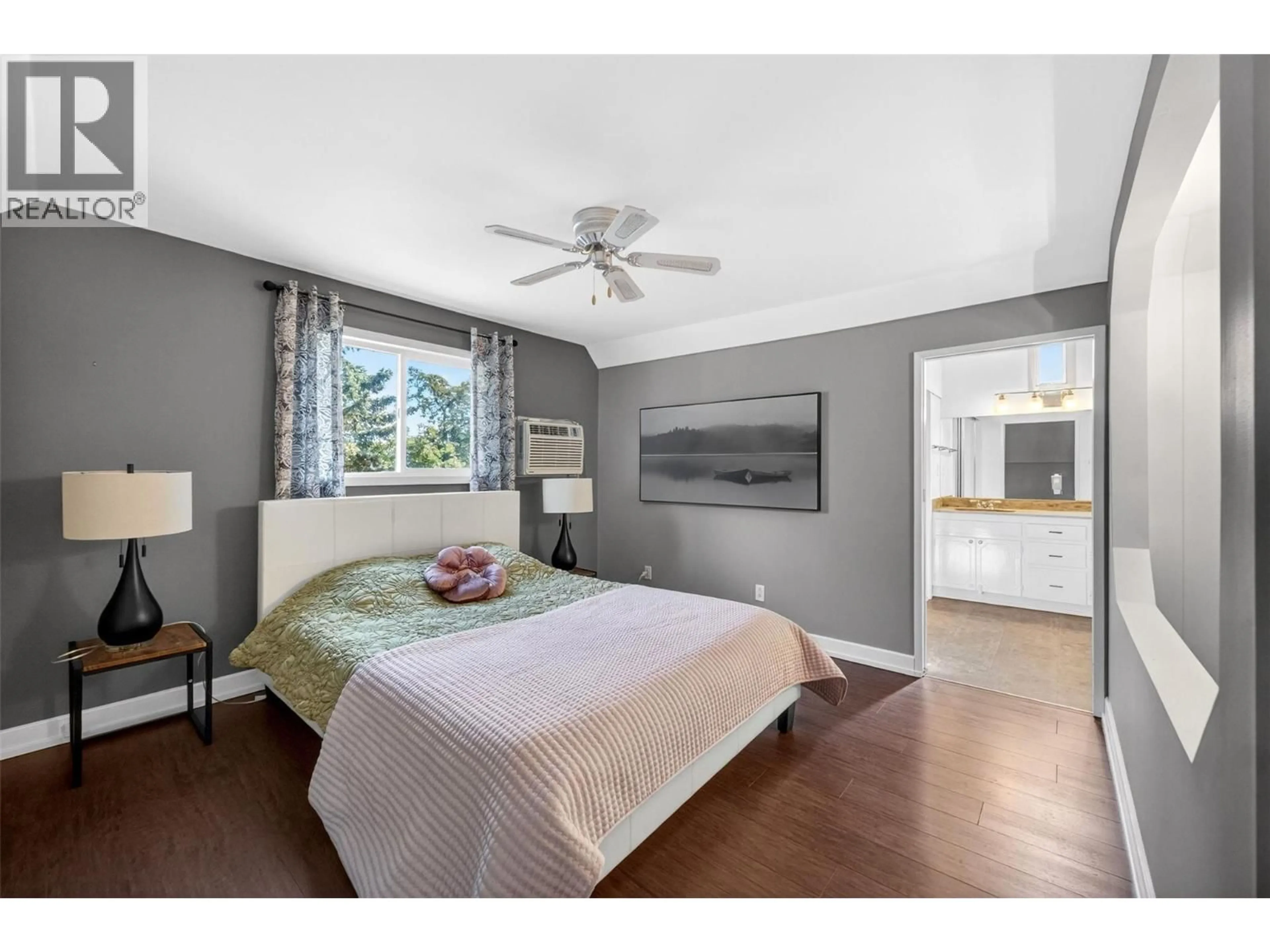 Bedroom with bed, wood/laminate floor for 900 SICAMOUS STREET, Enderby British Columbia V0E1V0
